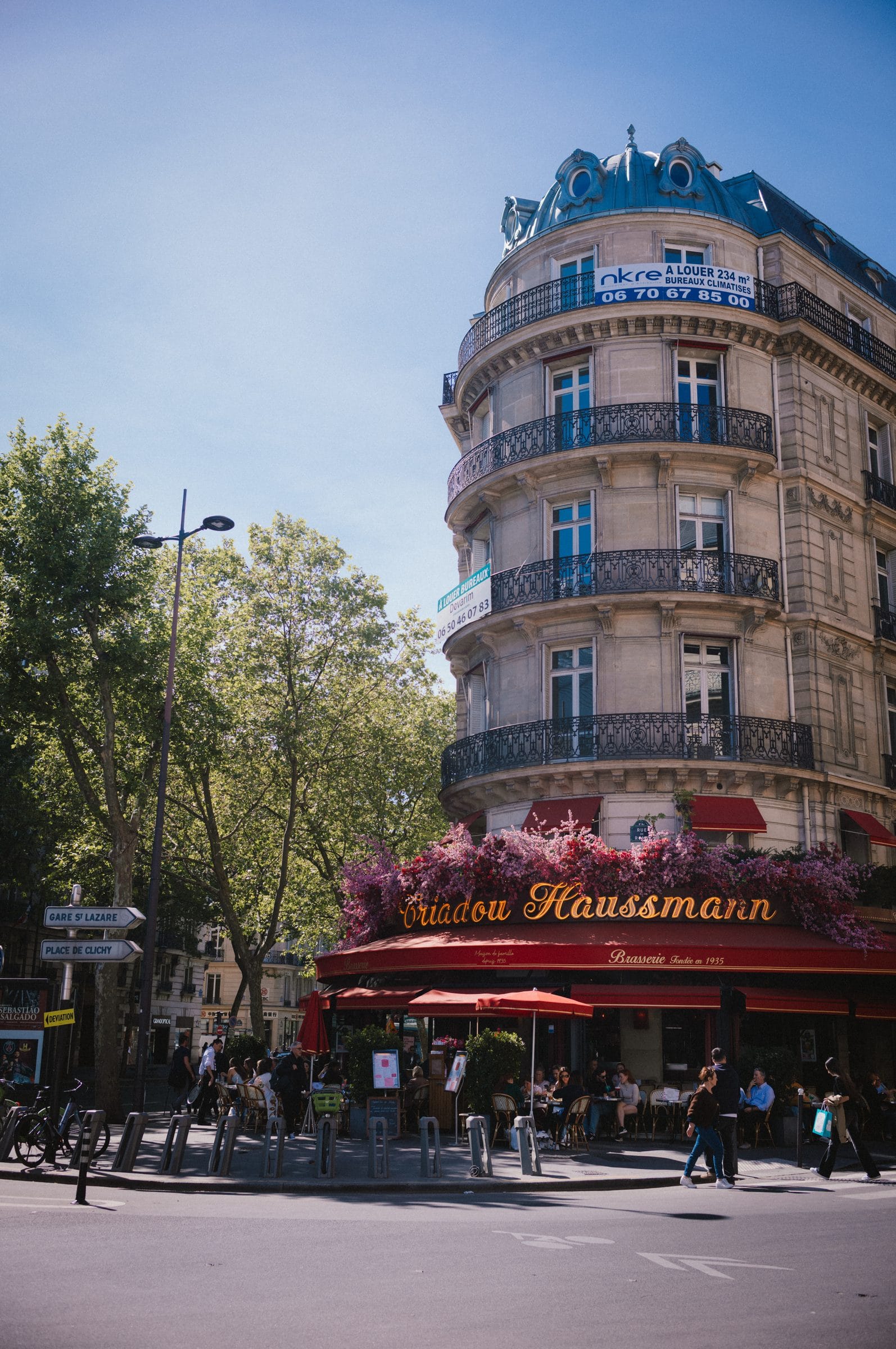 Haussmann’s Paris: the corner building, the balconies, the trees.