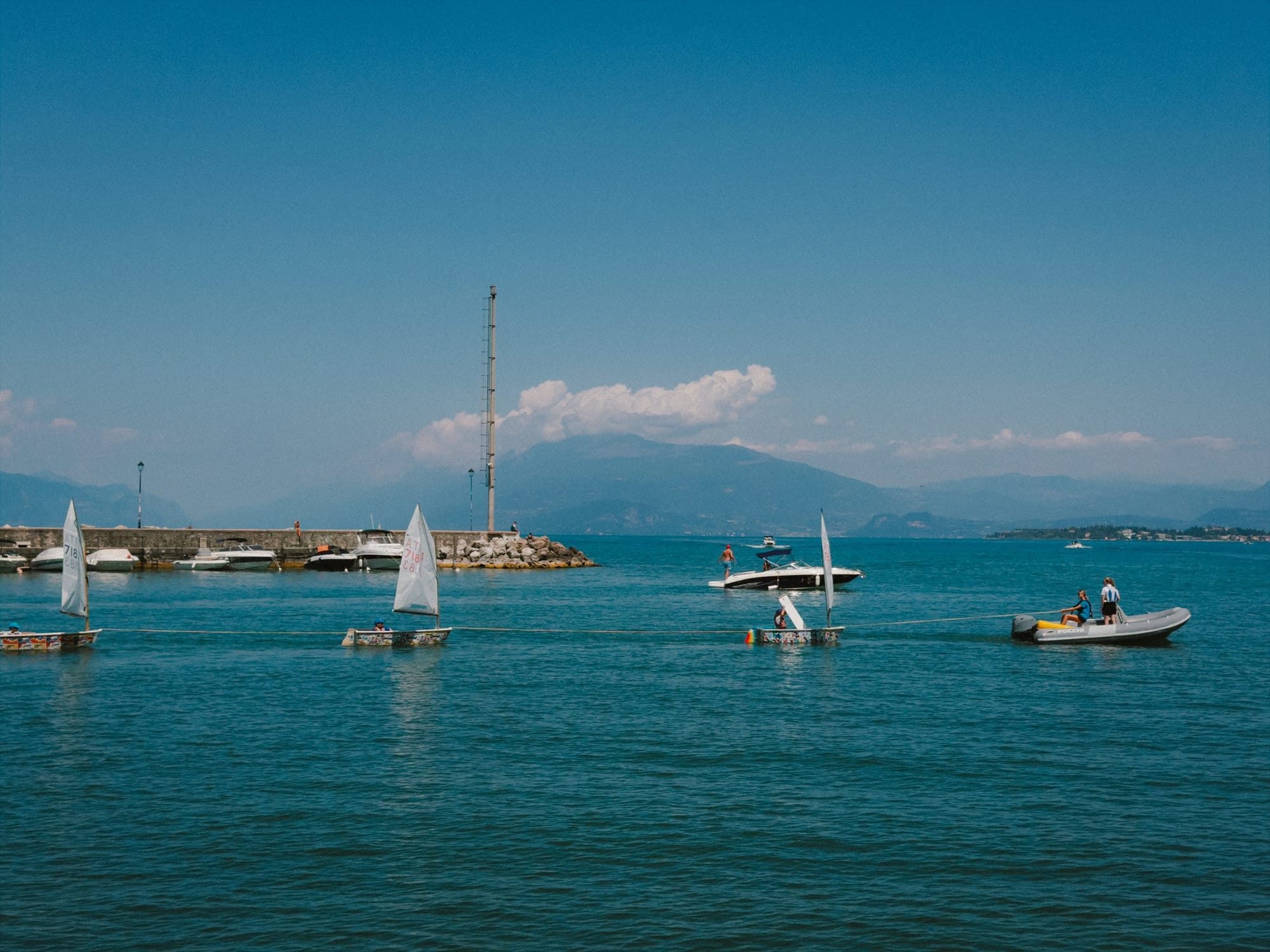 Sailboats off the harbour wall