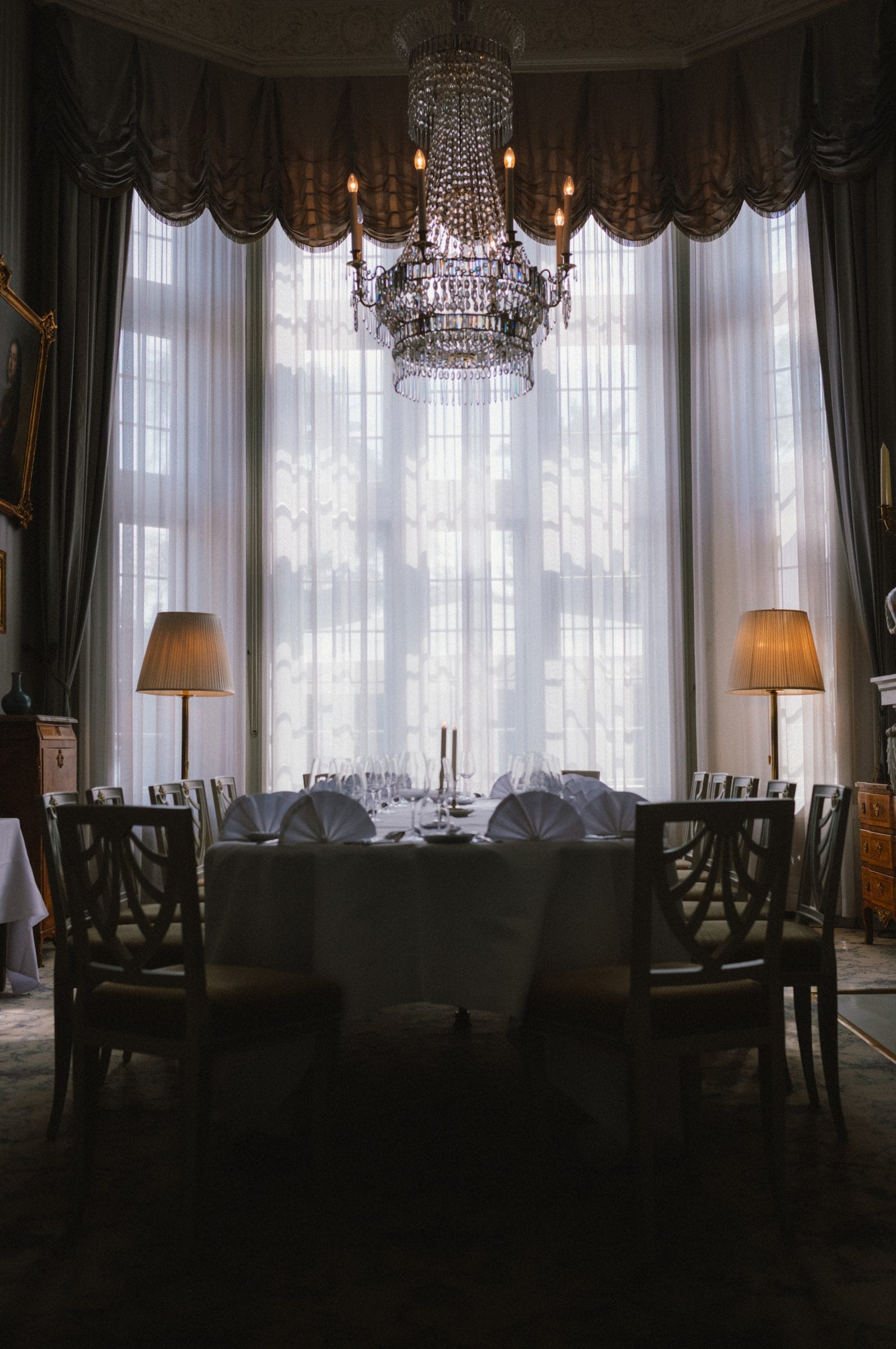 The dining room under a chandelier
