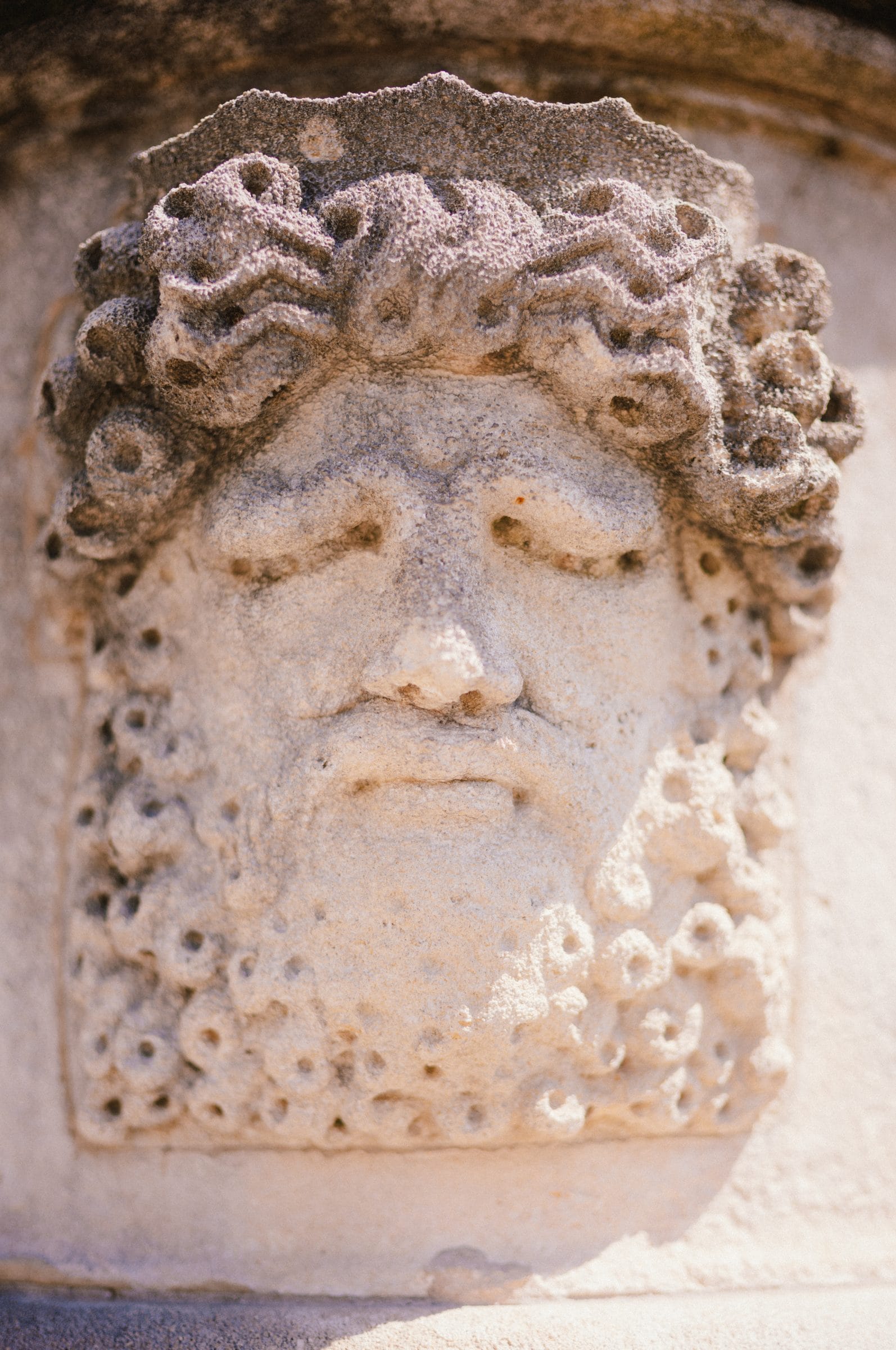 A carved face in stone
