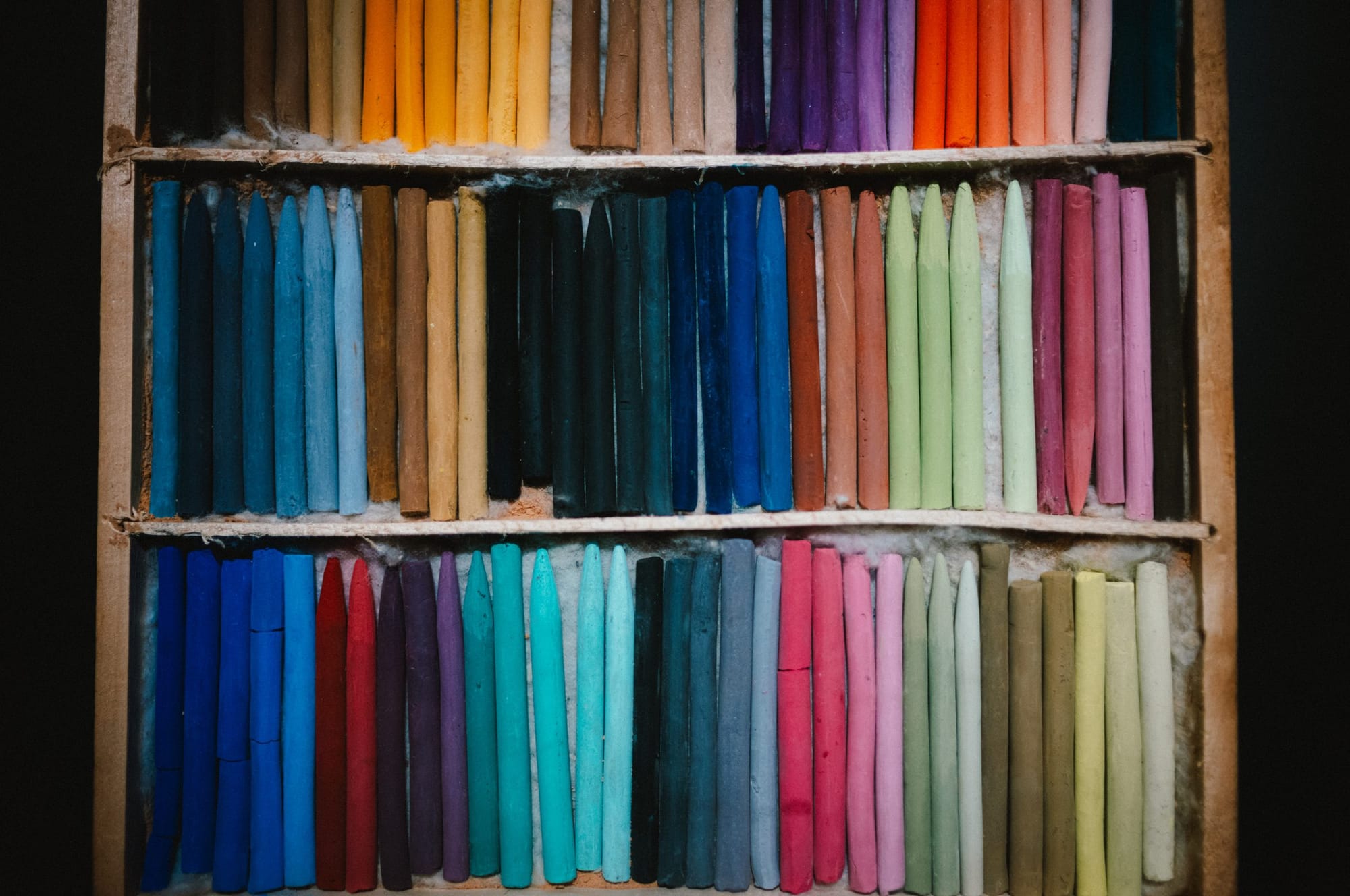 Bolts of cloth on a shelf