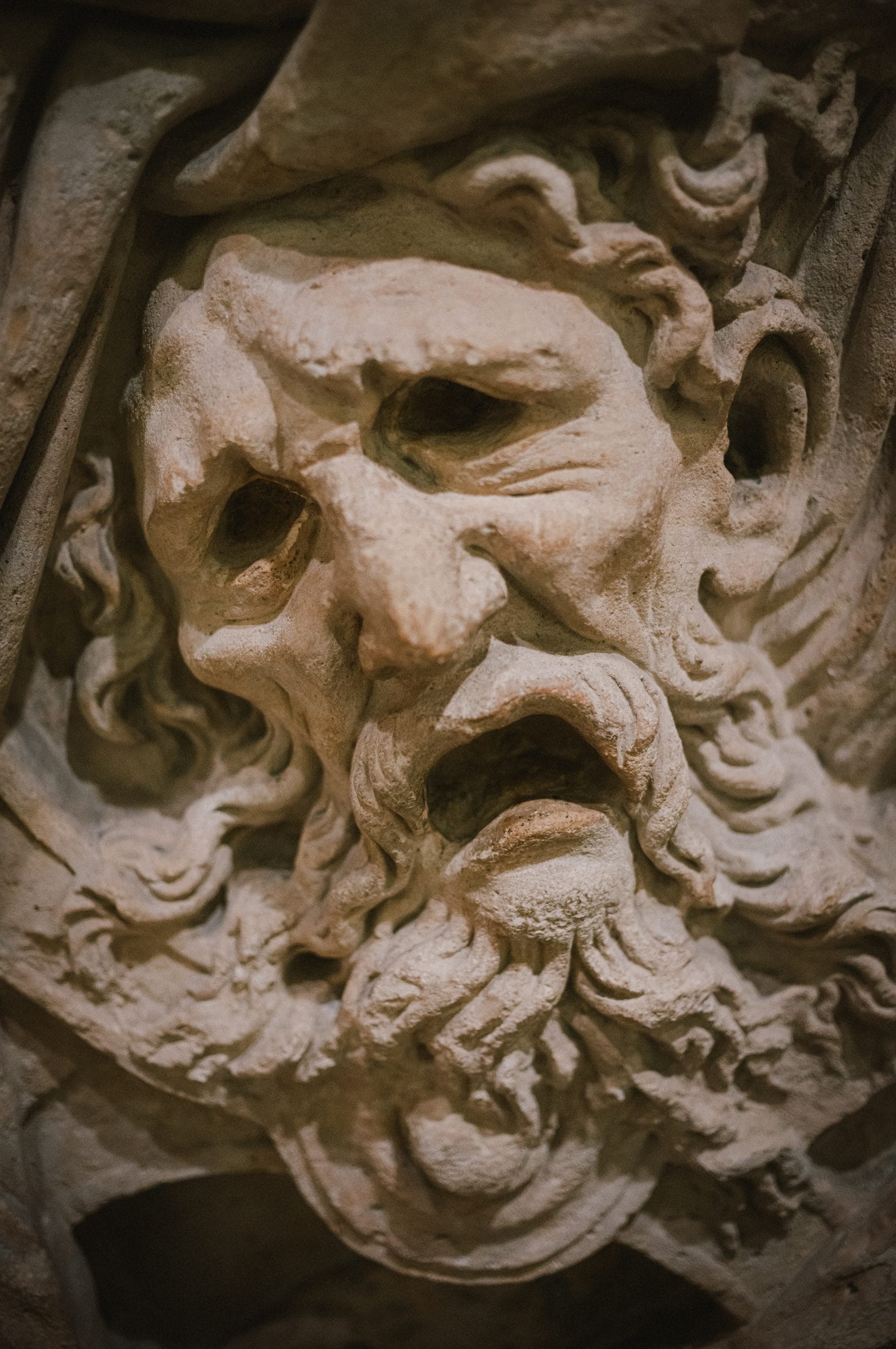 A carved stone head at the Louvre