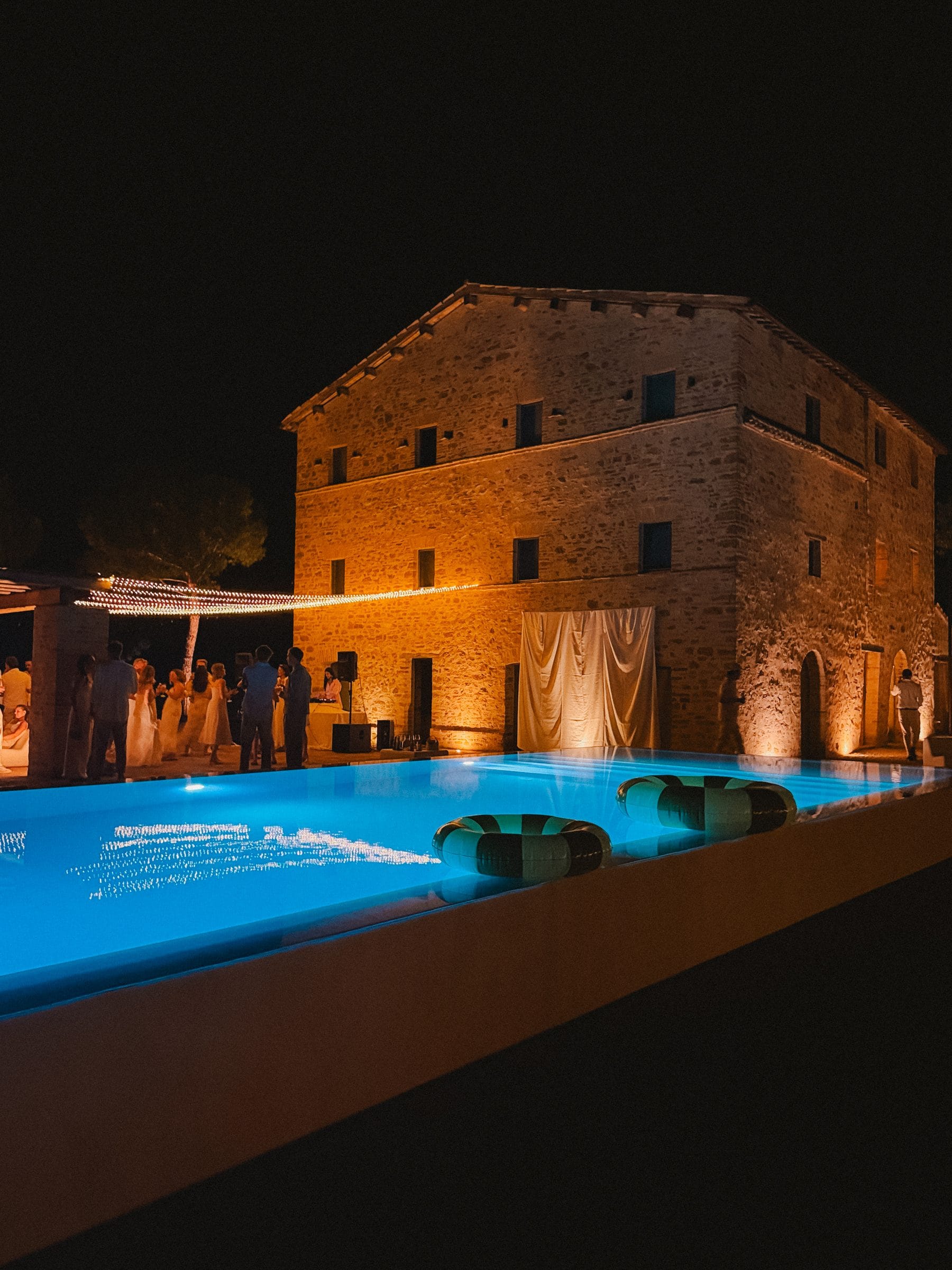 The villa and its pool at night