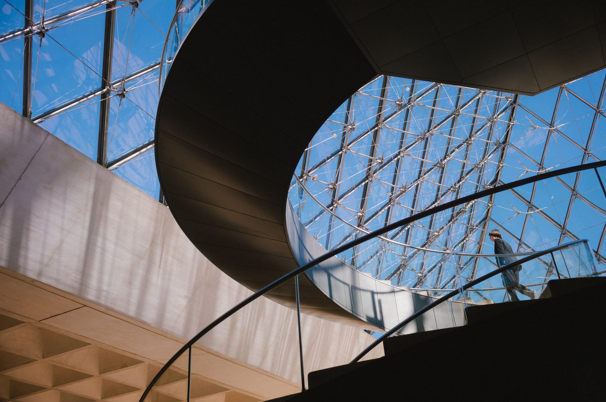 Inside the pyramid: the stair, the glass, the sky.