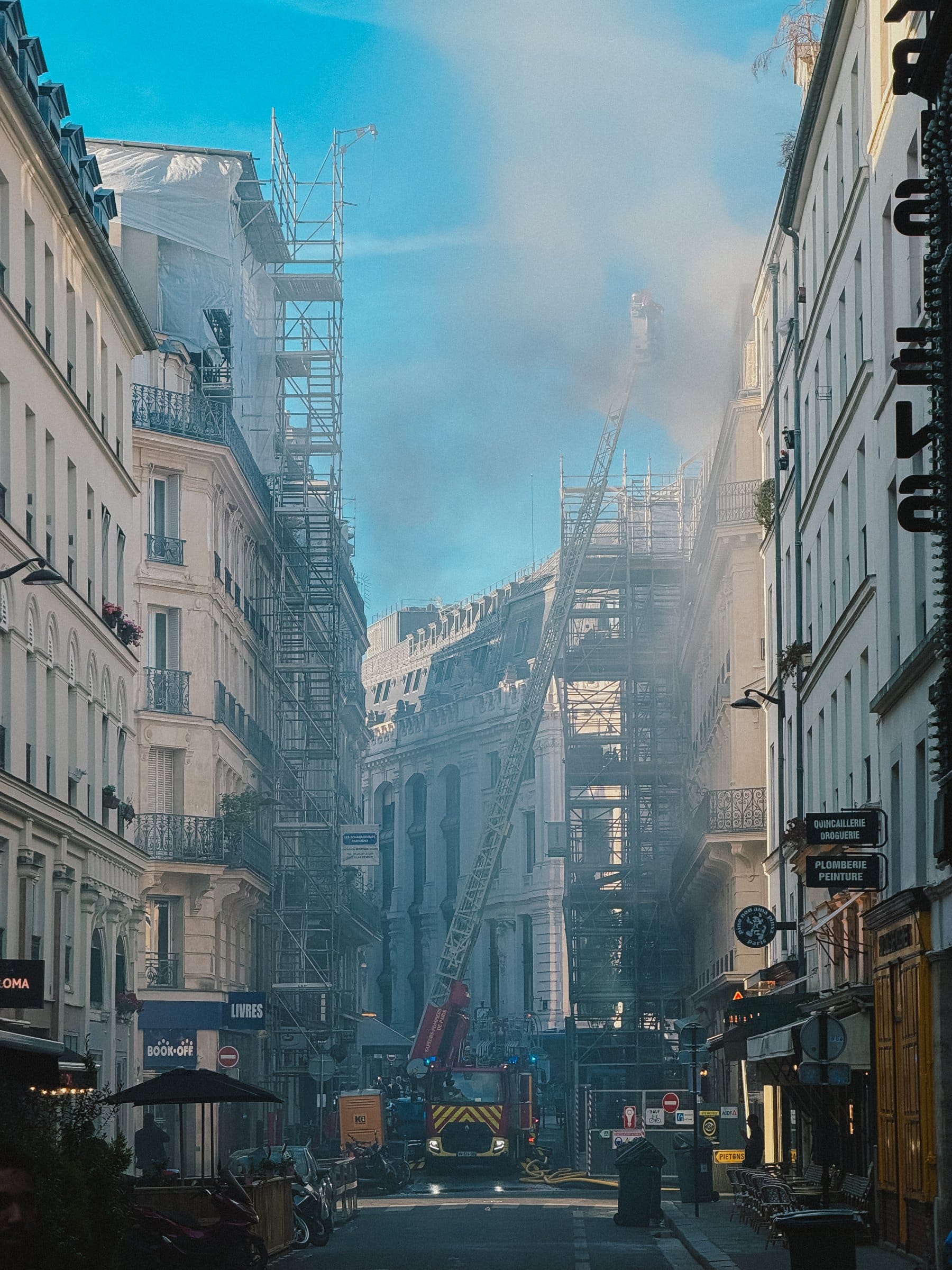 A street narrowing toward the sun.