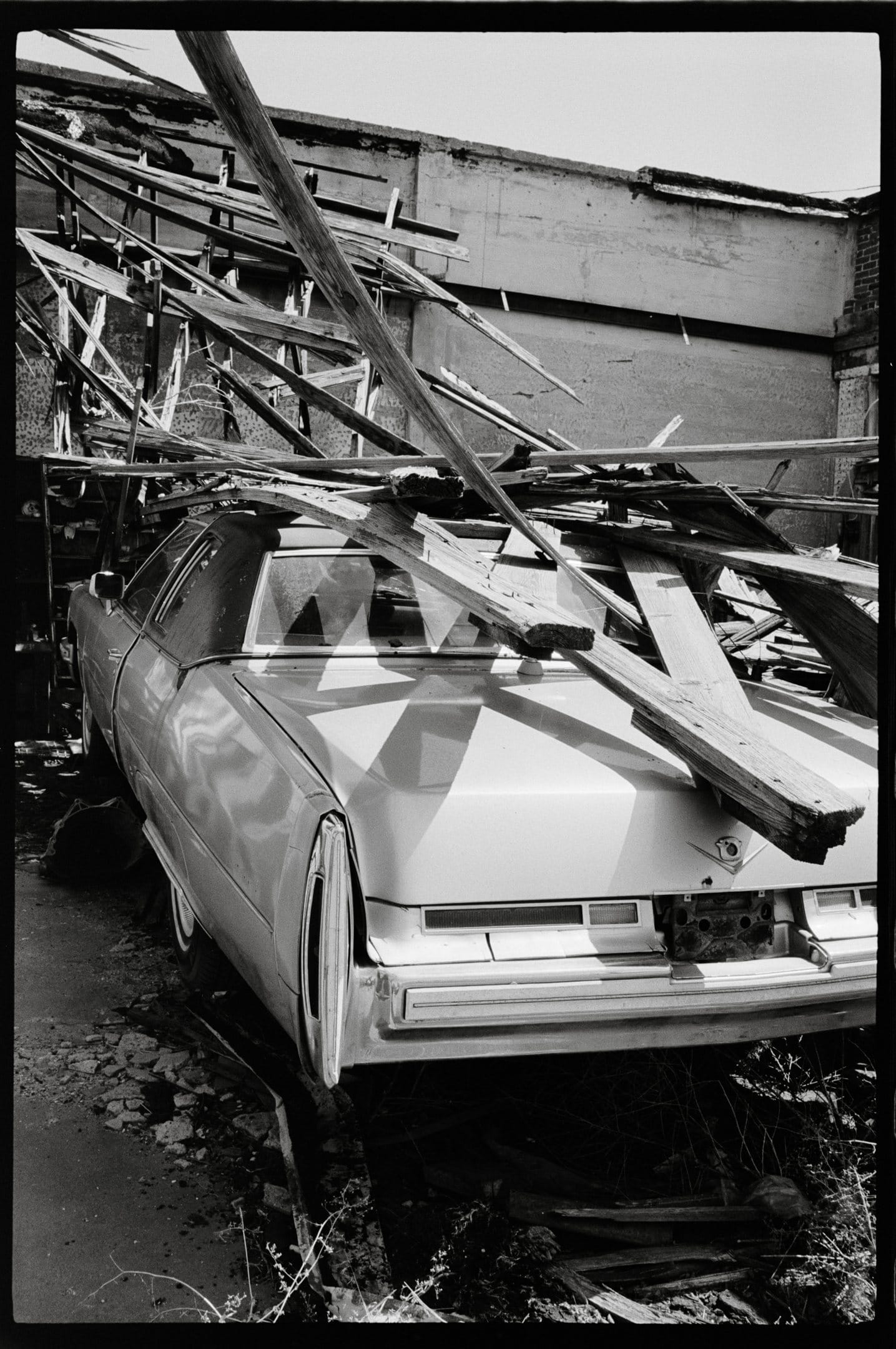 Wreckage in the weeds.