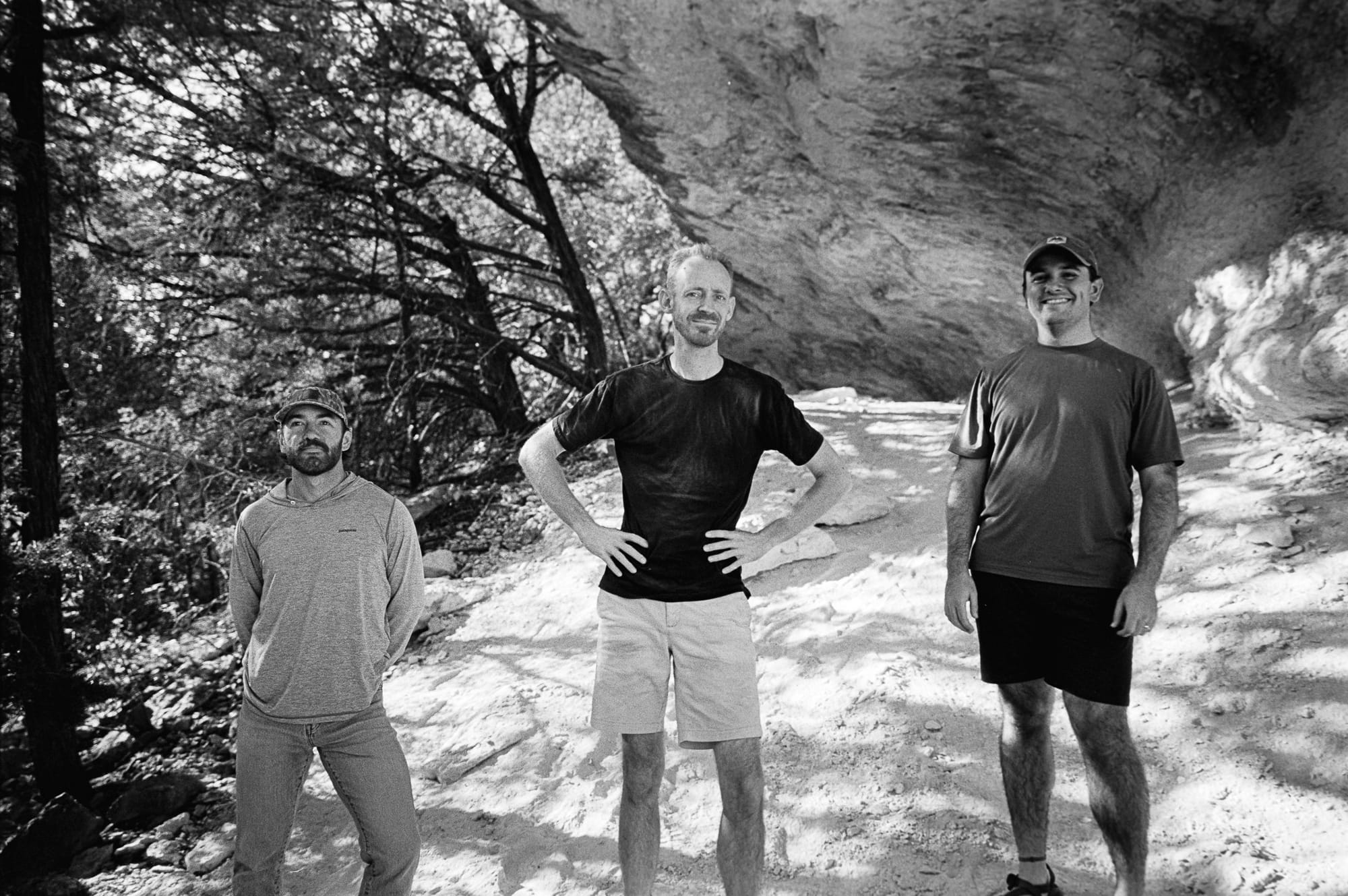 Three men in the light.