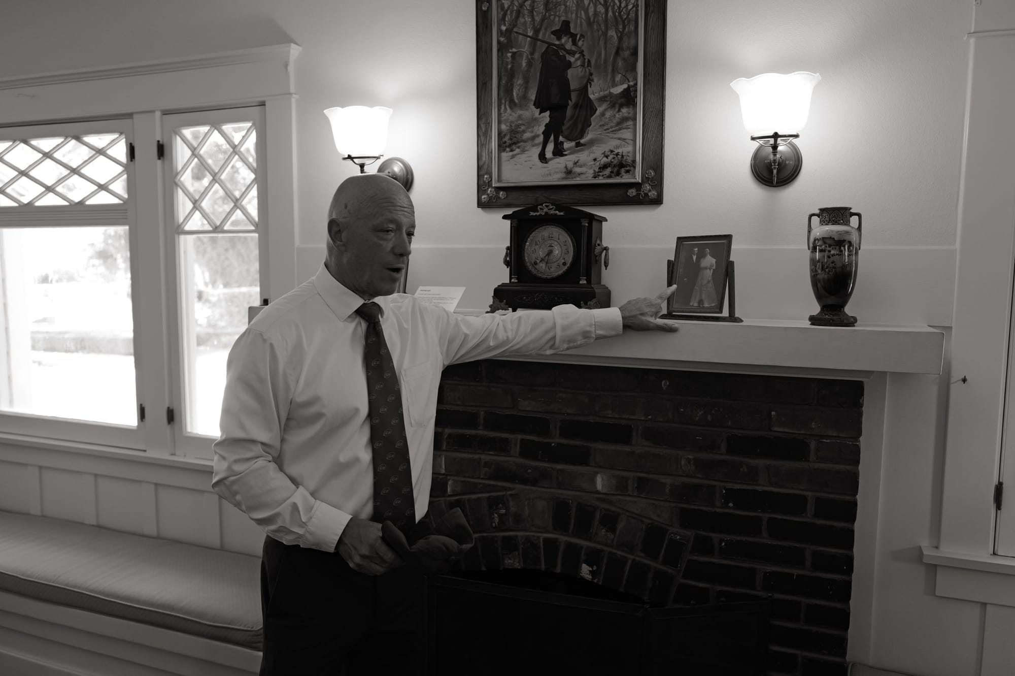 The docent at the fireplace.