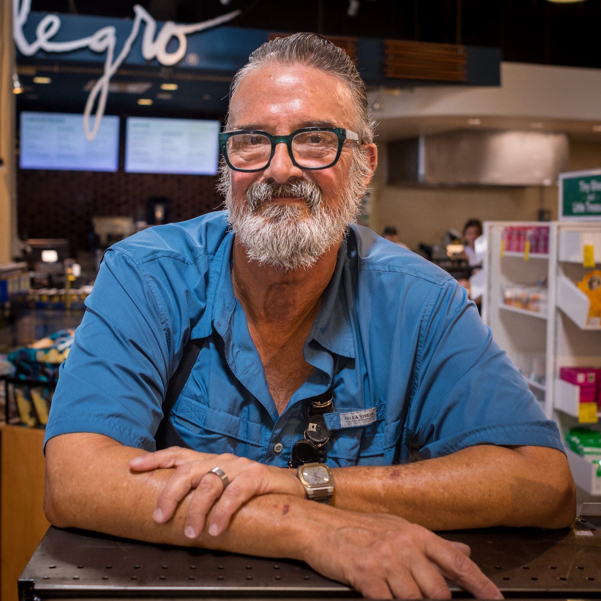 Matt leaning on the counter of a coffee bar