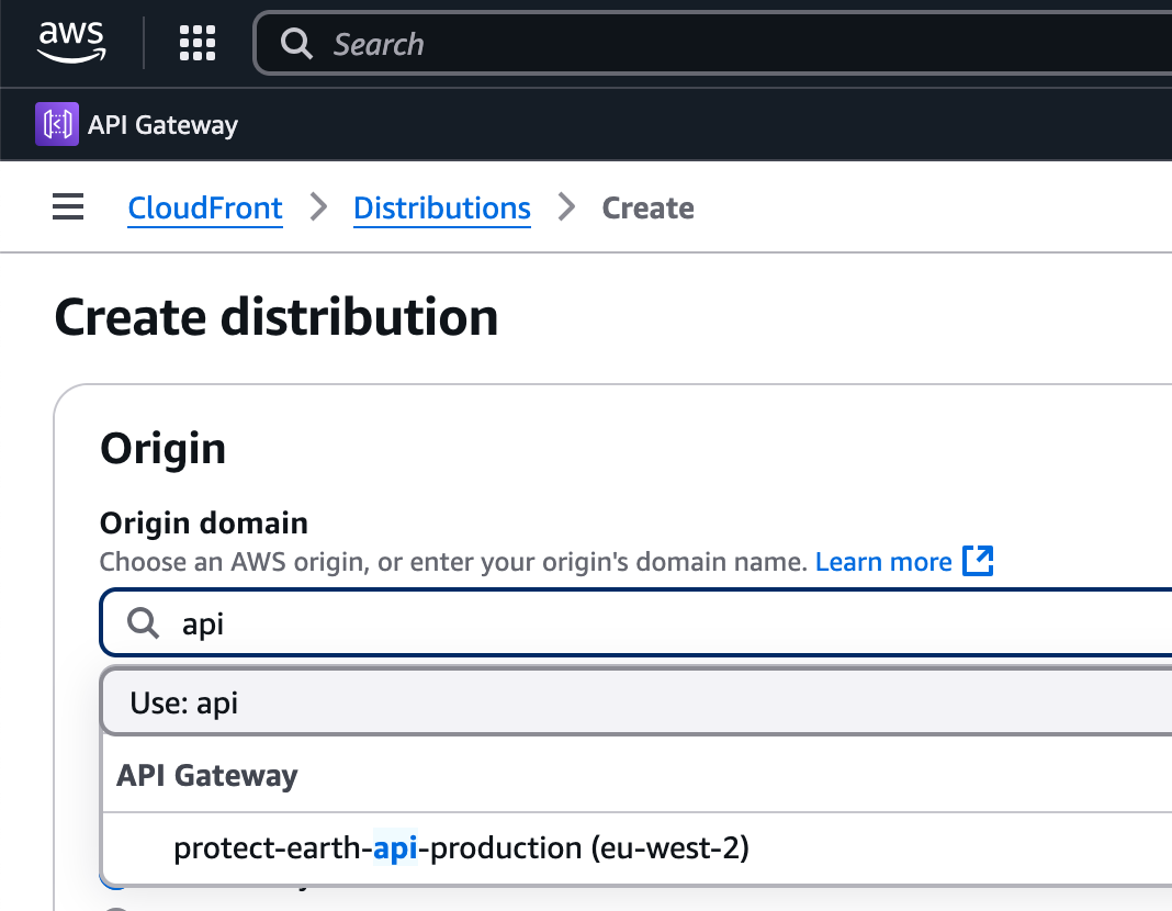 Screenshot of the AWS interface, CloudFront section, under Distributions on the nav, titled Create distribution. Origin section is asking for an AWS origin or original domain name, with the "protect-earth-api-production" API gateway selected as the origin.