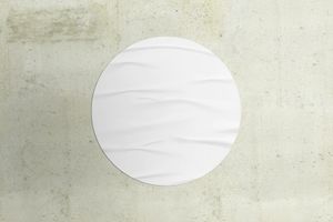 Round Paper Poster on Concrete Wall Mockup