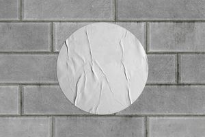Round Wrinkled Poster on Brick Wall Mockup