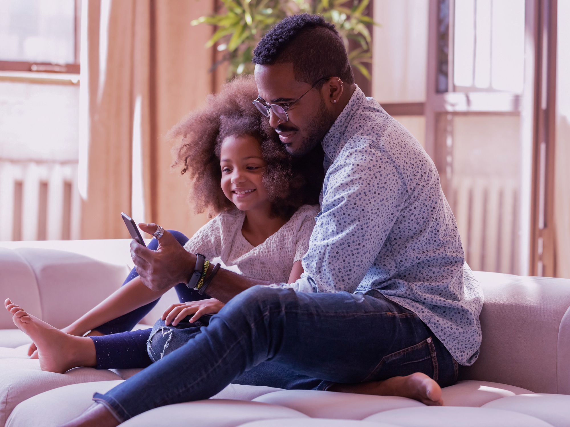 Father-and-daughter-looking-at-crypto-investment