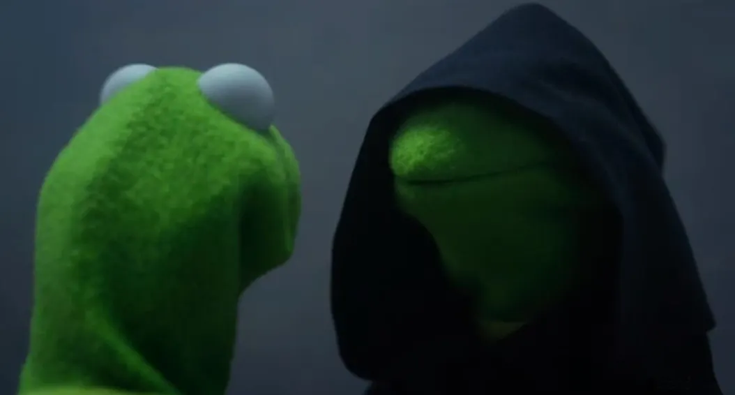 regular kermit looks at "evil kermit" (kermit waering a black hood