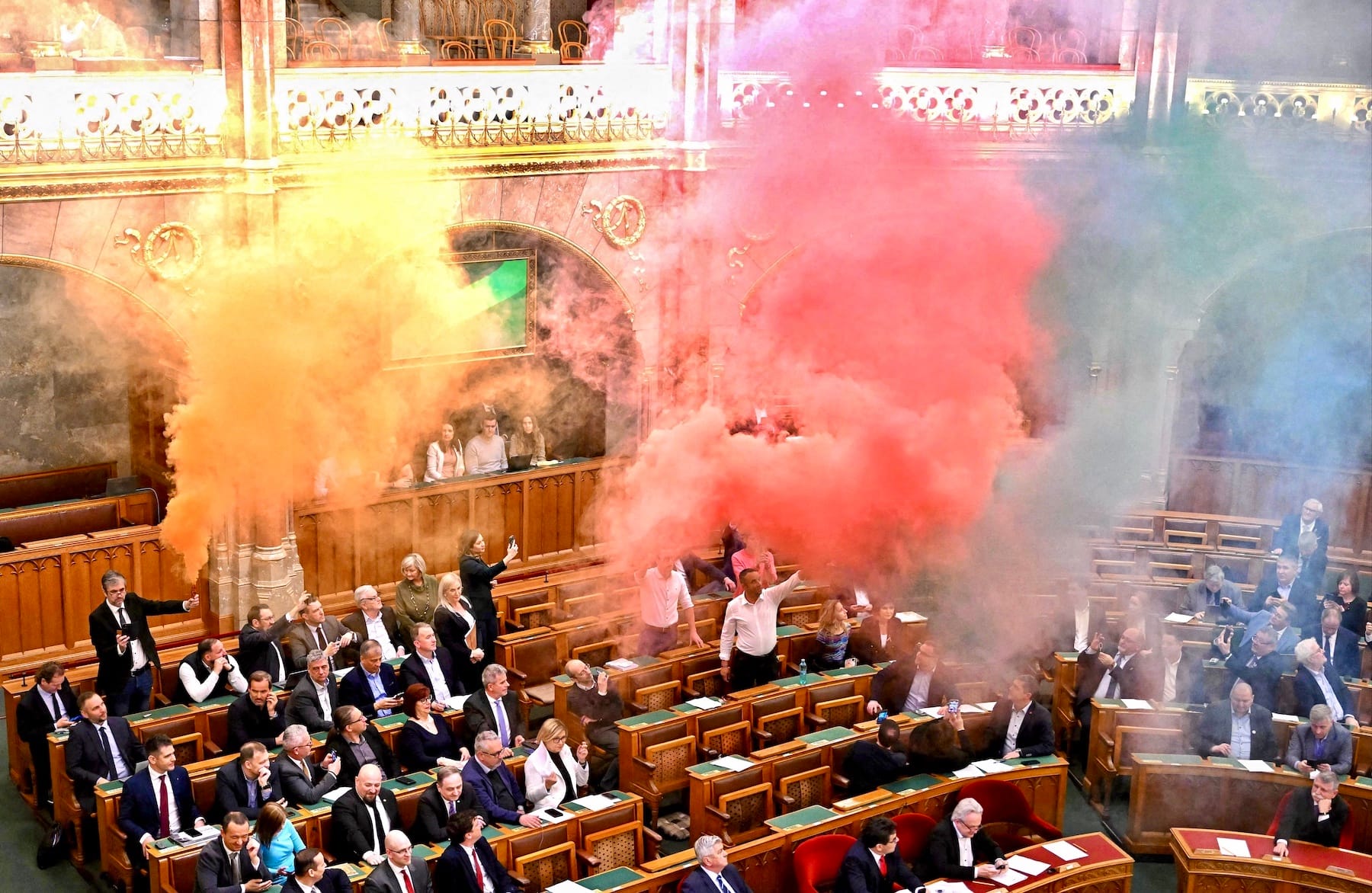 hungarian lawmakers rainbow smoke bomb parliament