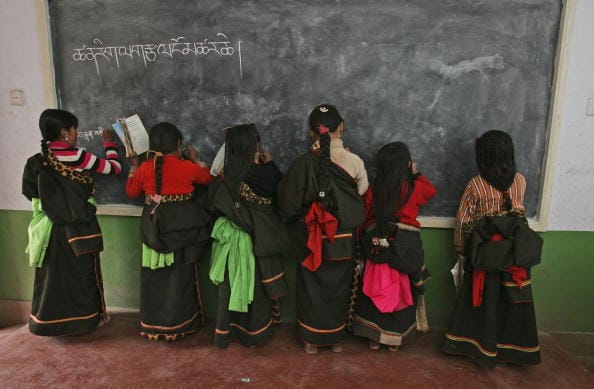 china ethnic unity law erase minorities uyghurs tibetans