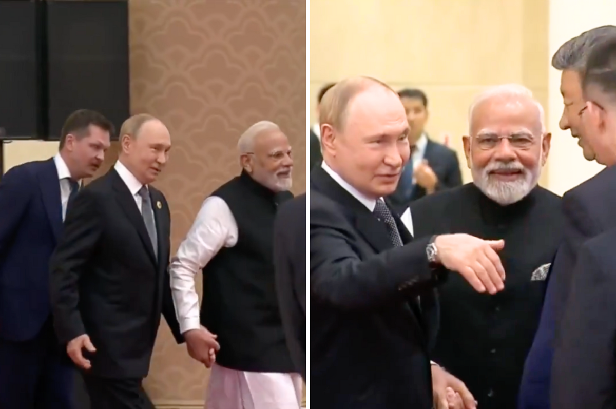 putin modi hold hands meet xi sco