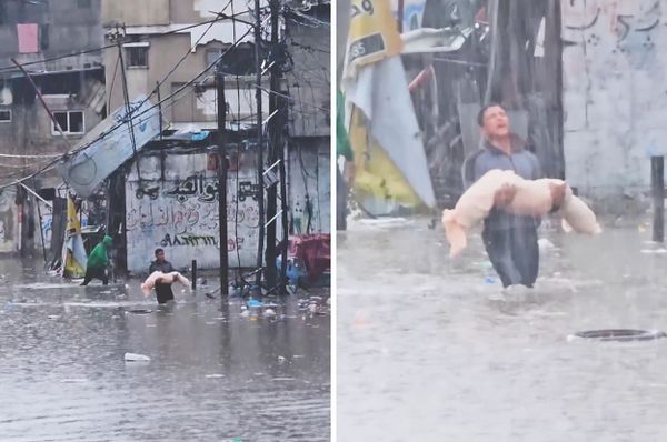 gaza boy carrying child body rain jabalia