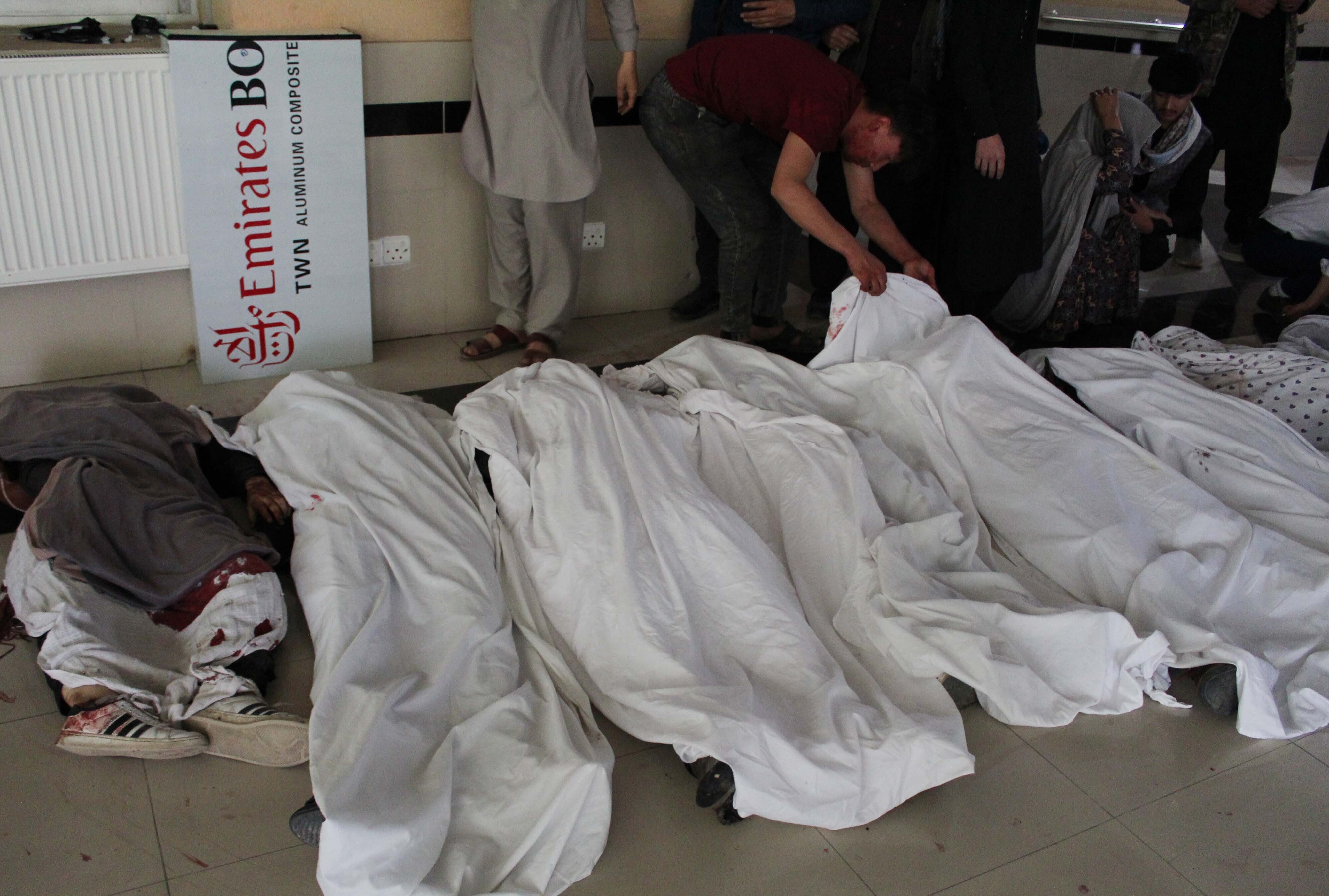 People search for relatives after at least 30 people, mostly schoolgirls, have been killed in three back-to-back blasts targeting a school in Afghanistanâs capital Kabul.