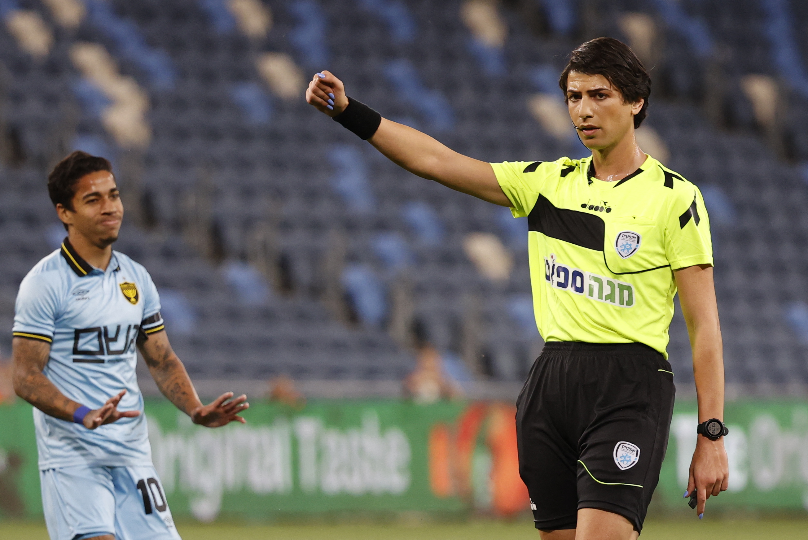 Israeli football referee Sapir Berman (R) gestures during the Israeli Premier League match between Hapoel Haifa and Beitar Jerusalem at Samy Ofer Stadium in Israel's northern Mediterranean coastal city of Haifa.