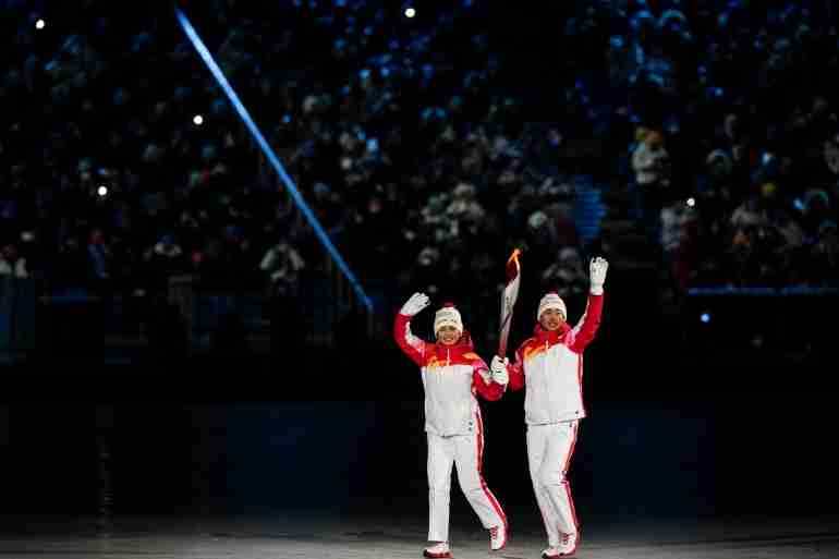 china uyghur torch bearer olympics dinigeer yilamujiang