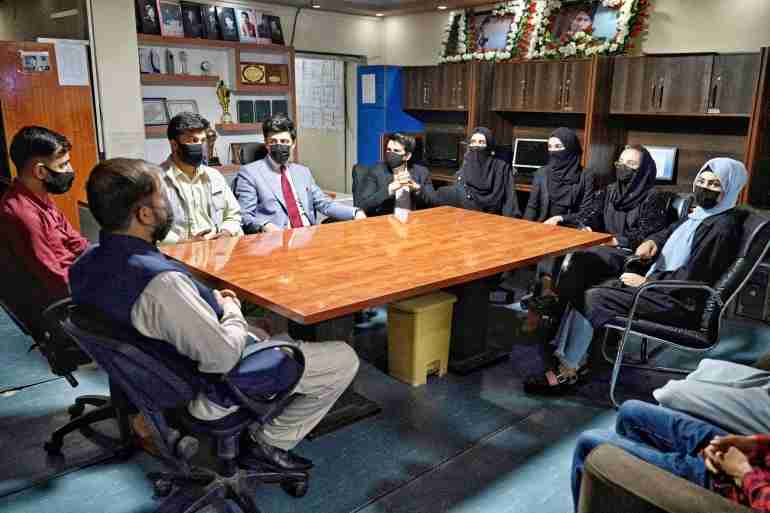 afghan male tv anchors cover faces support women