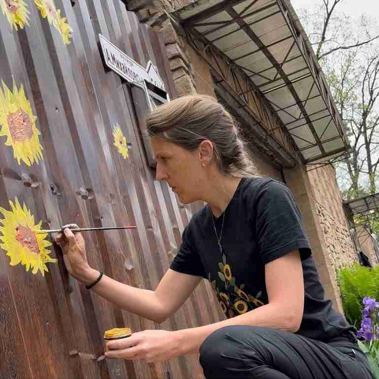 flowers over bullet holes bucha ukraine ivanka siolkowsky