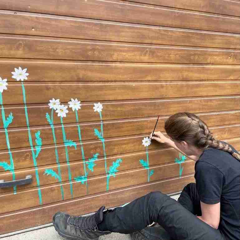 flowers over bullet holes bucha ukraine ivanka siolkowsky