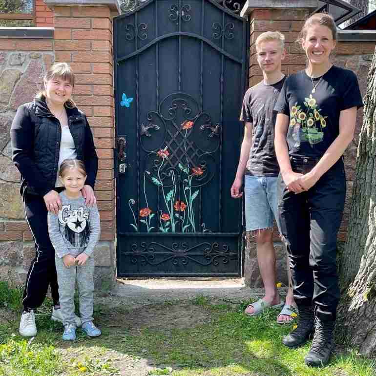 flowers over bullet holes bucha ukraine ivanka siolkowsky