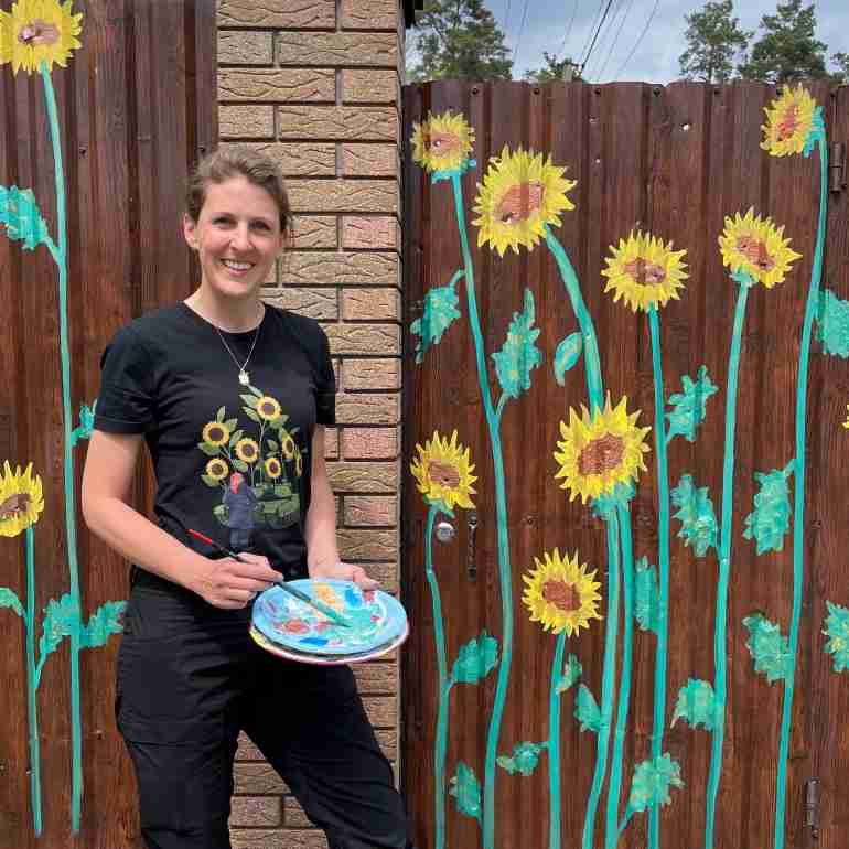 flowers over bullet holes bucha ukraine ivanka siolkowsky