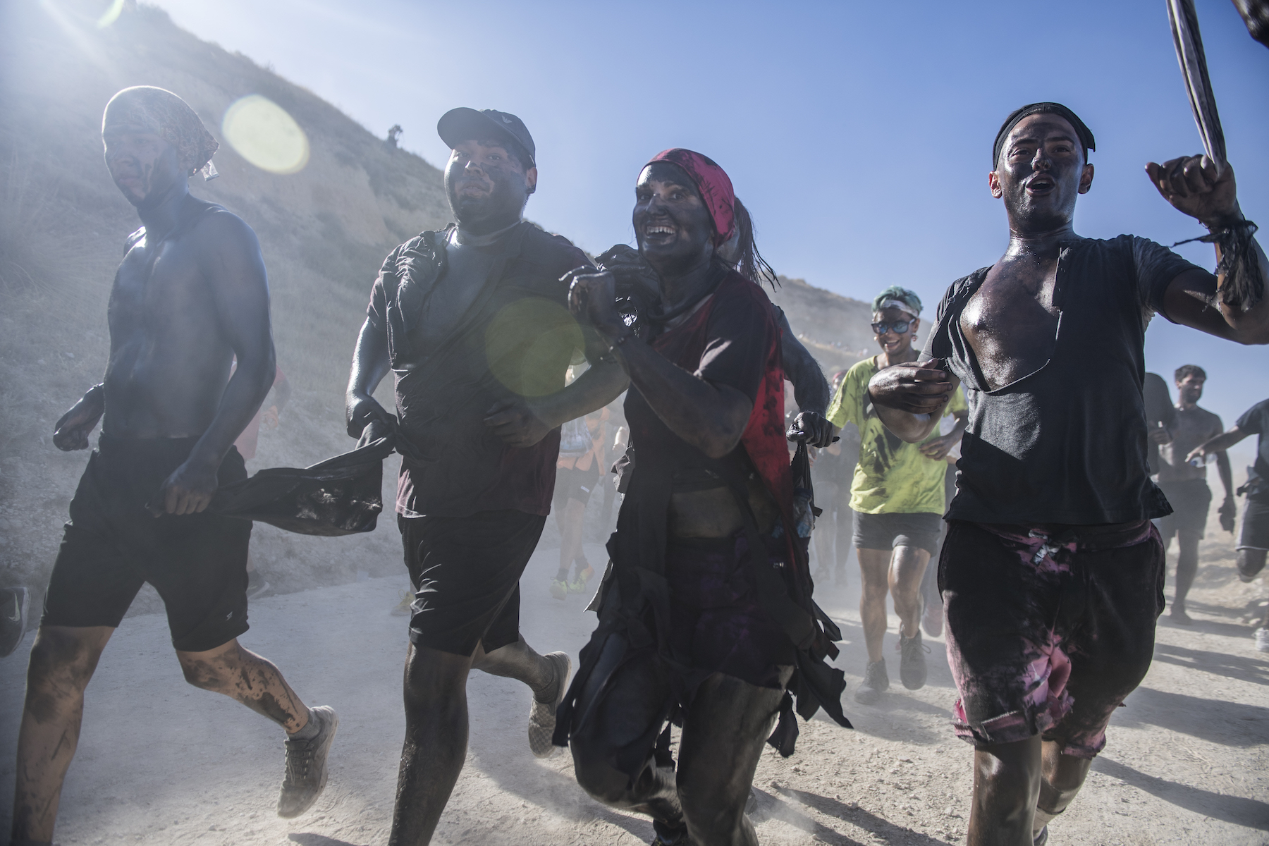 spain cascamorras people running greasy