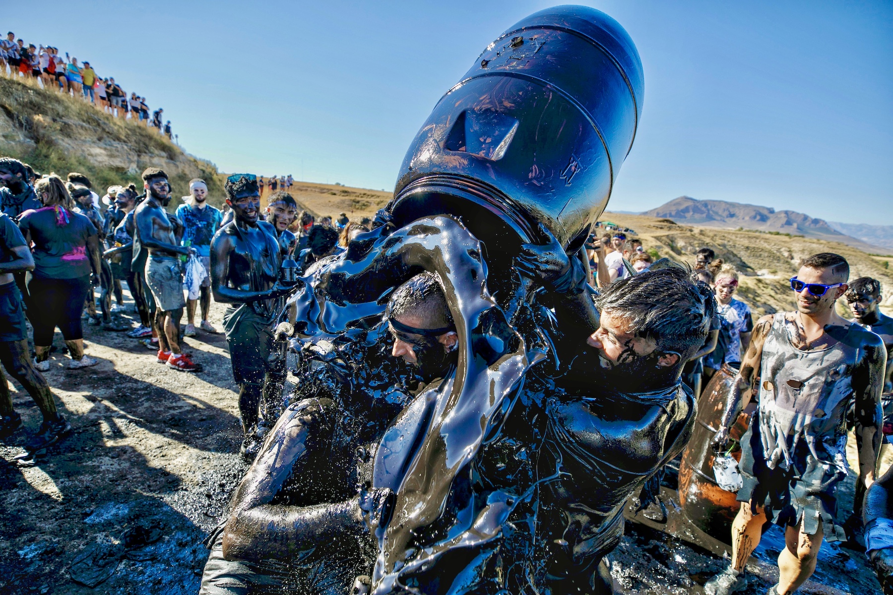 spain grease festival barrel people