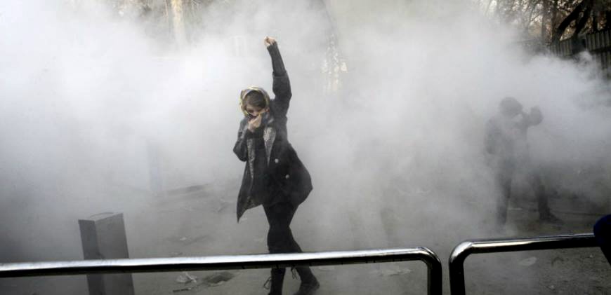 women fist protest hijab laws mahsa amini