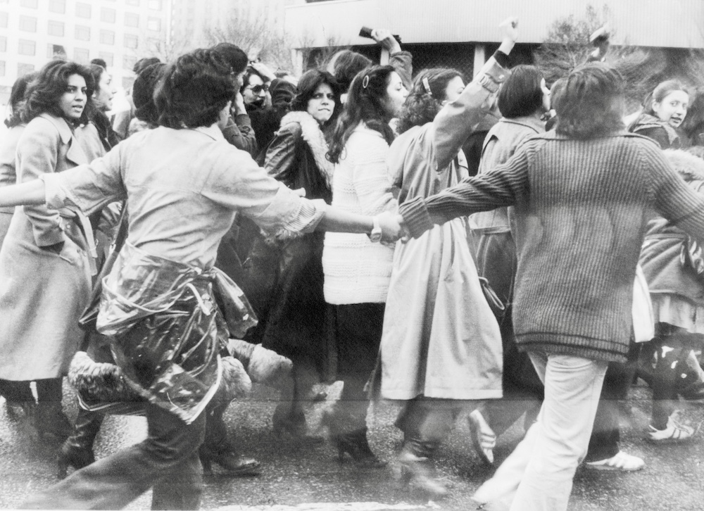 women men protest mandatory hijab laws iranian revolution