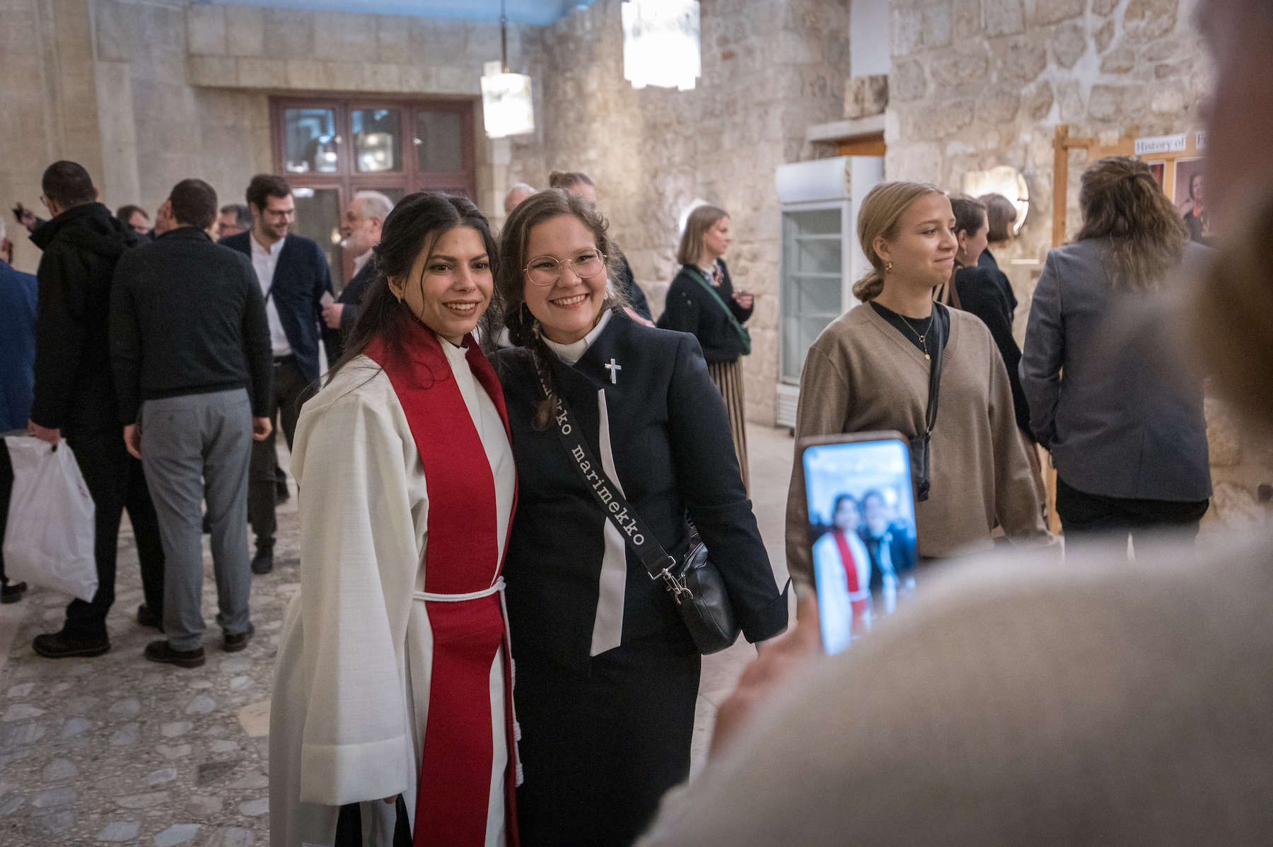 pastor sally azar taking picture after being ordained