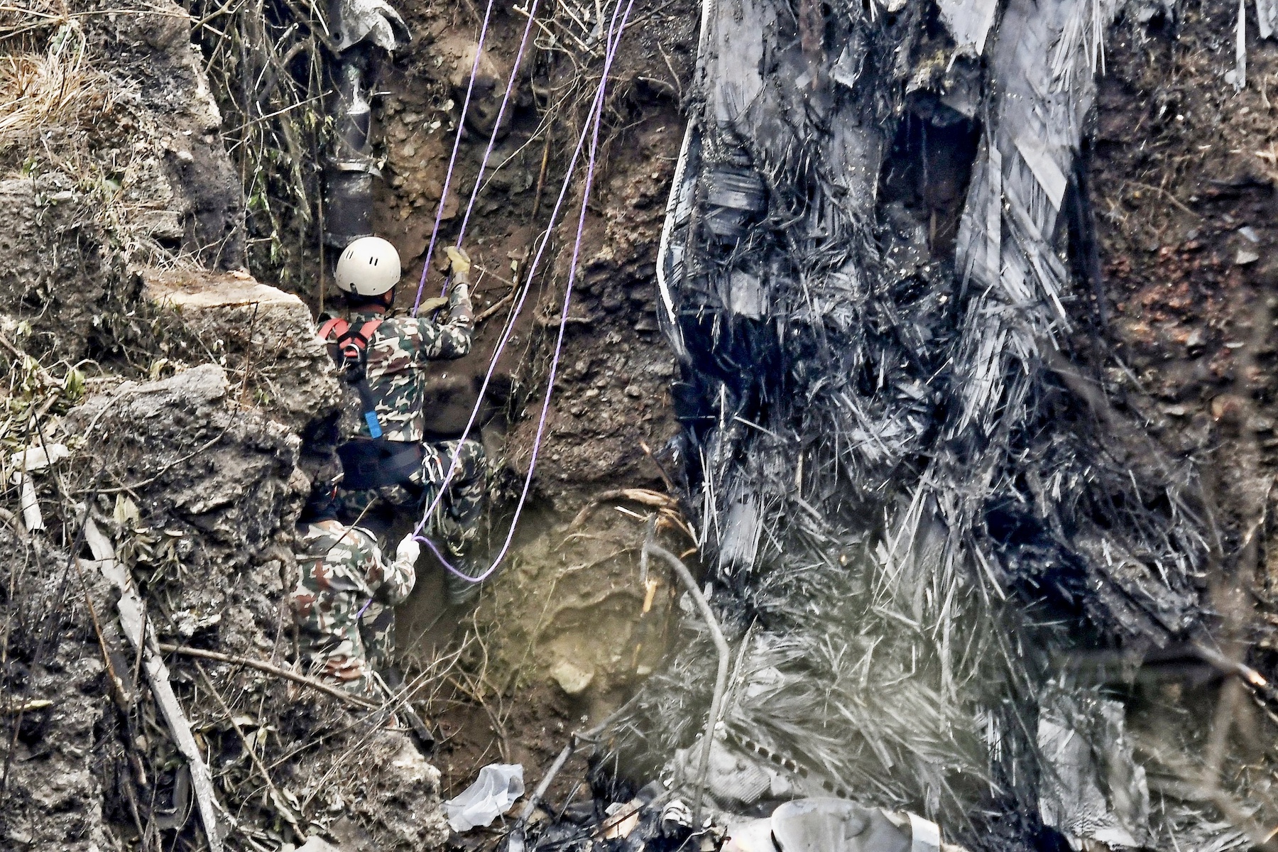 nepal plane crash 2023 searching victims yeti airlines wrecks