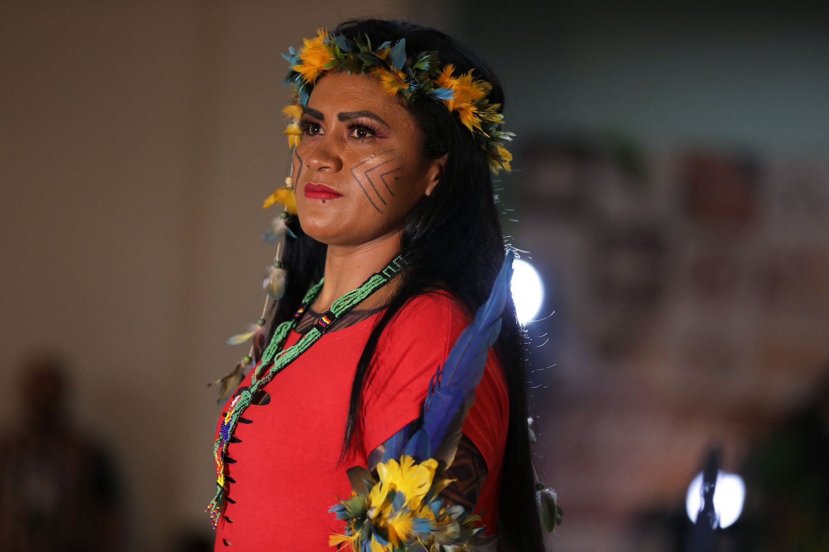 An indigenous model presents a creation during a fashion event in Manaus, Amazonas state, Brazil