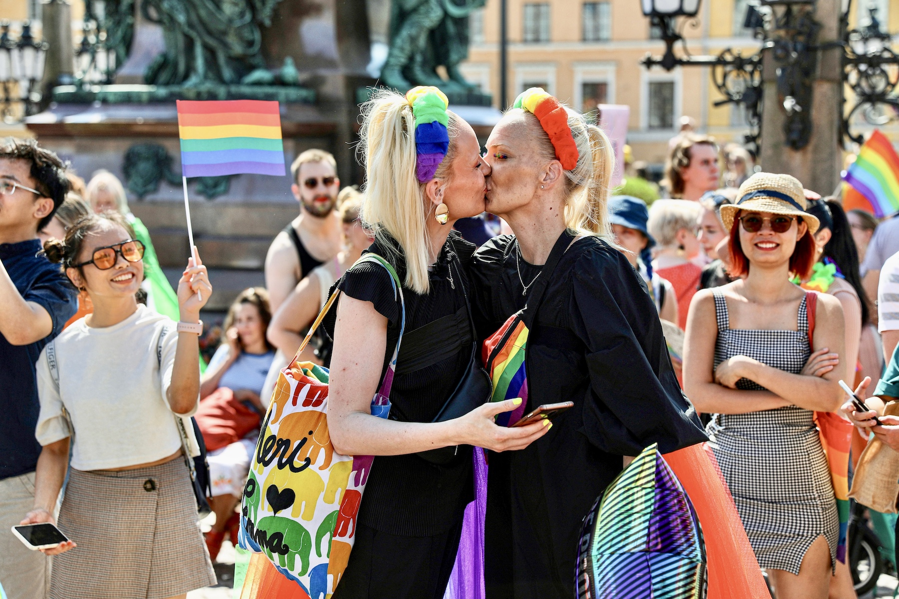 a couple kissed at a pride parade