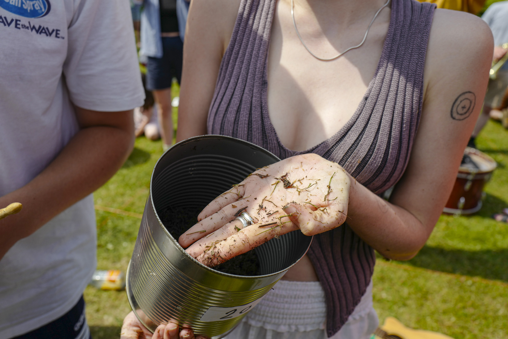 A woman competitor showing off her worm that got her win the competition