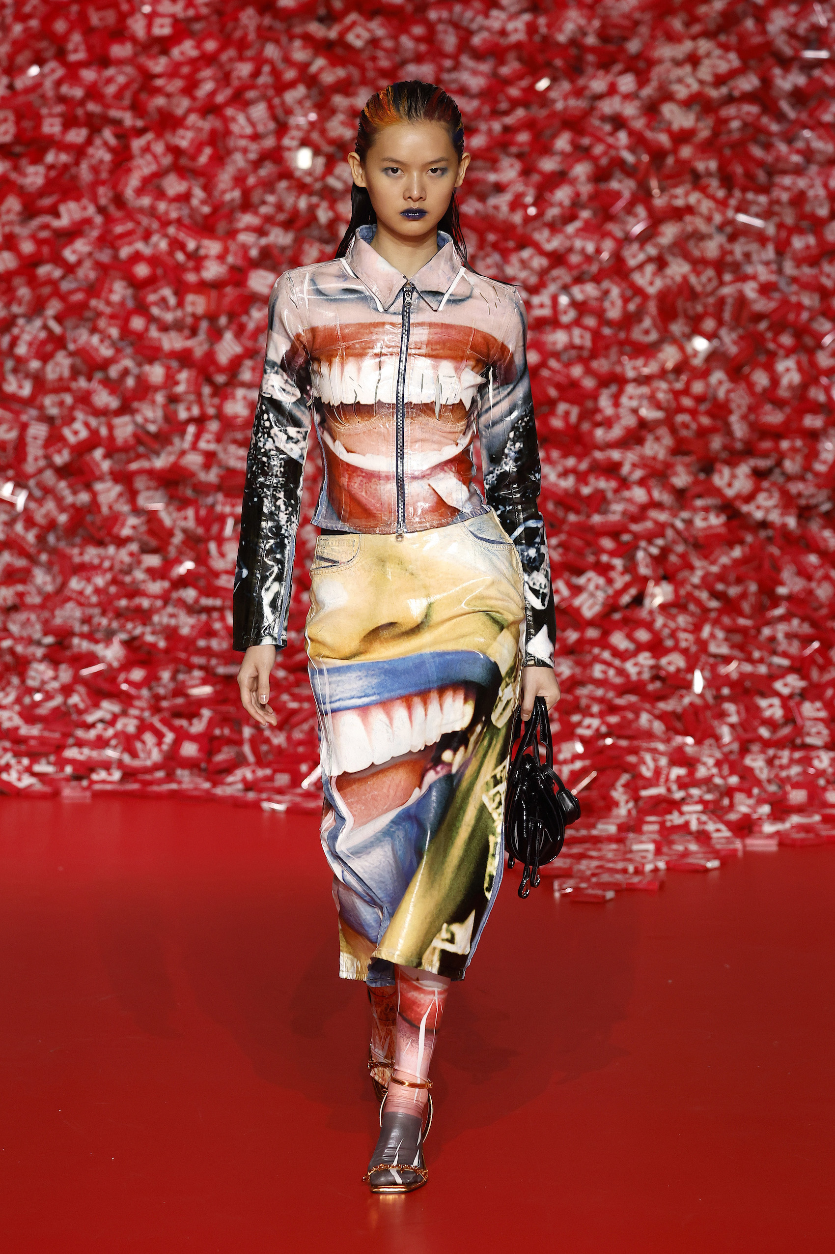 A model walks the runway at the Diesel fashion show during the Milan Fashion Week