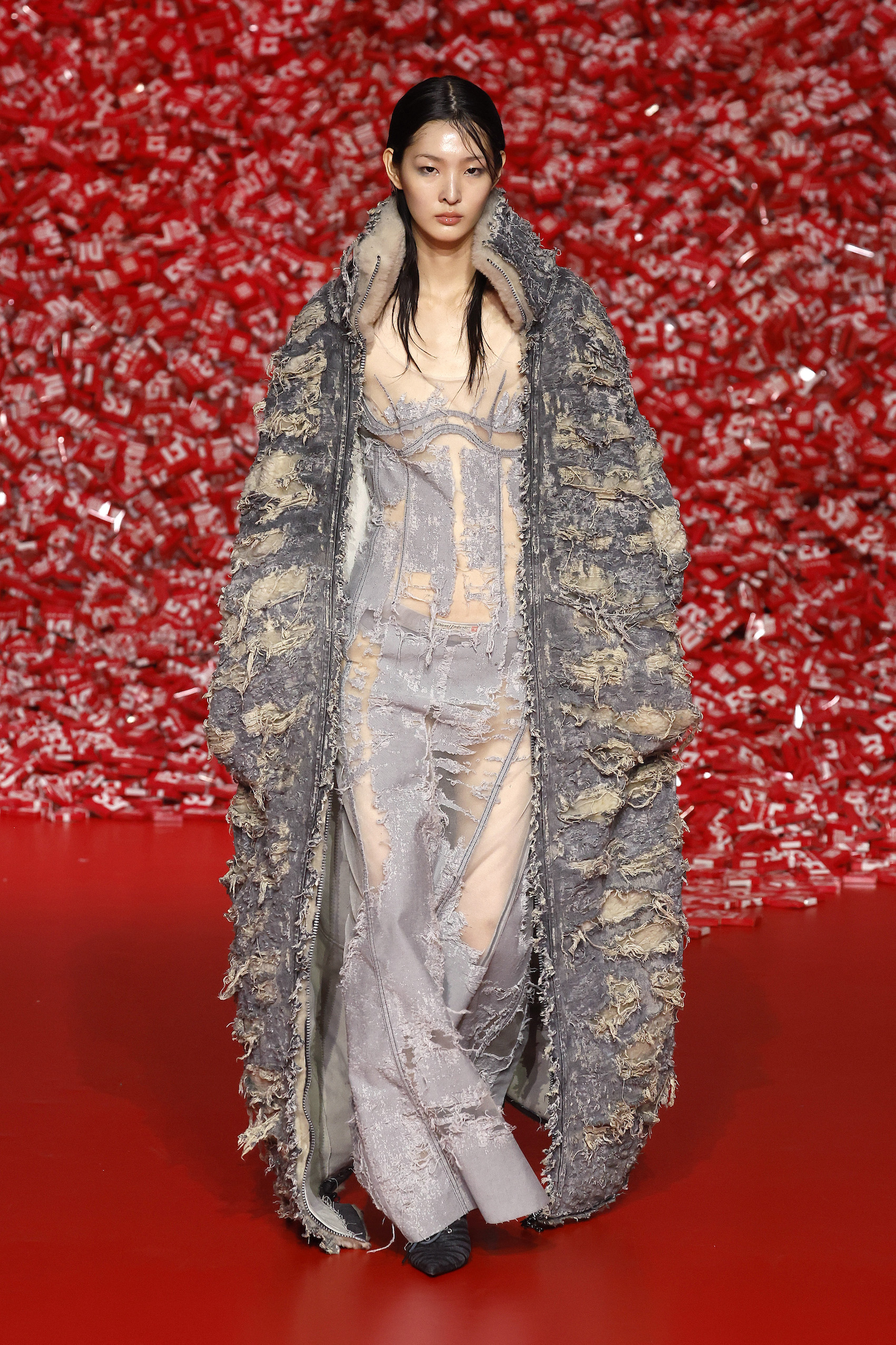 A model walks the runway at the Diesel fashion show during the Milan Fashion Week