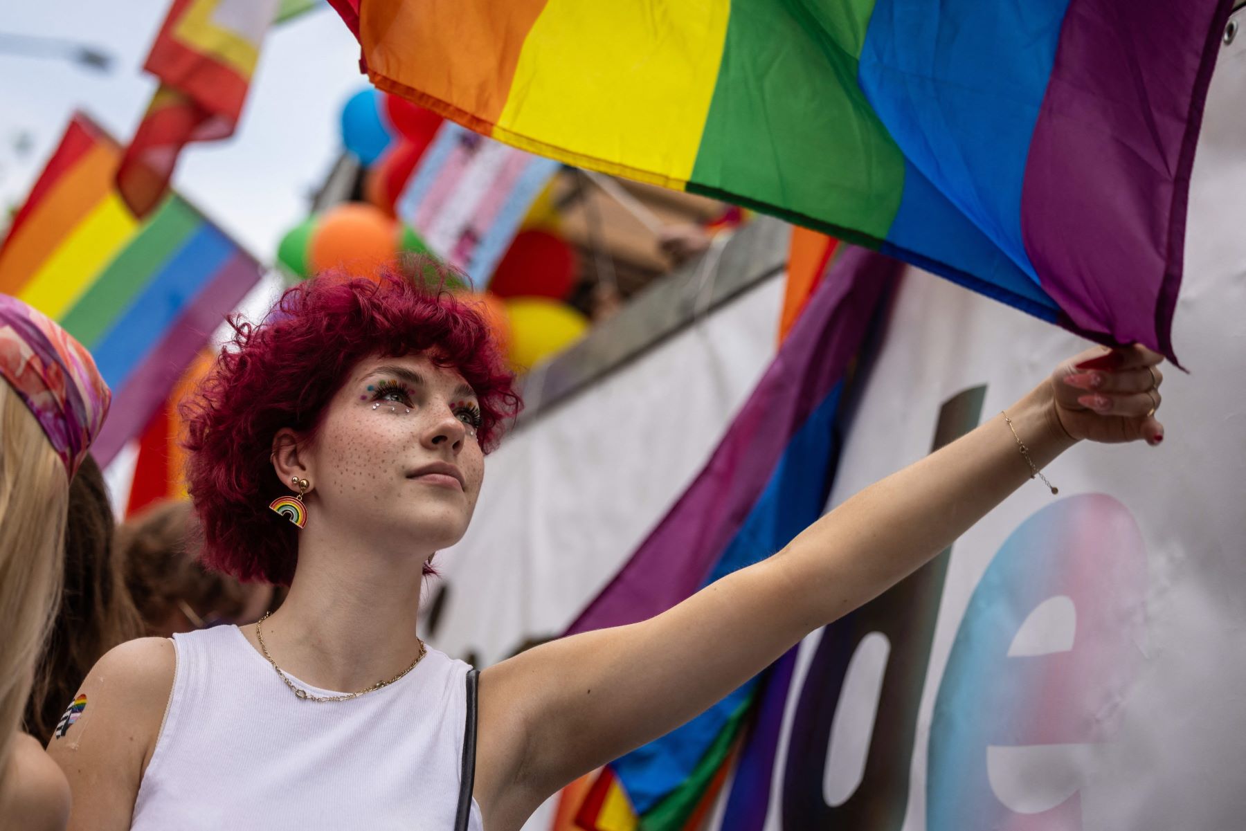 people-holding-the-rainbow-flag