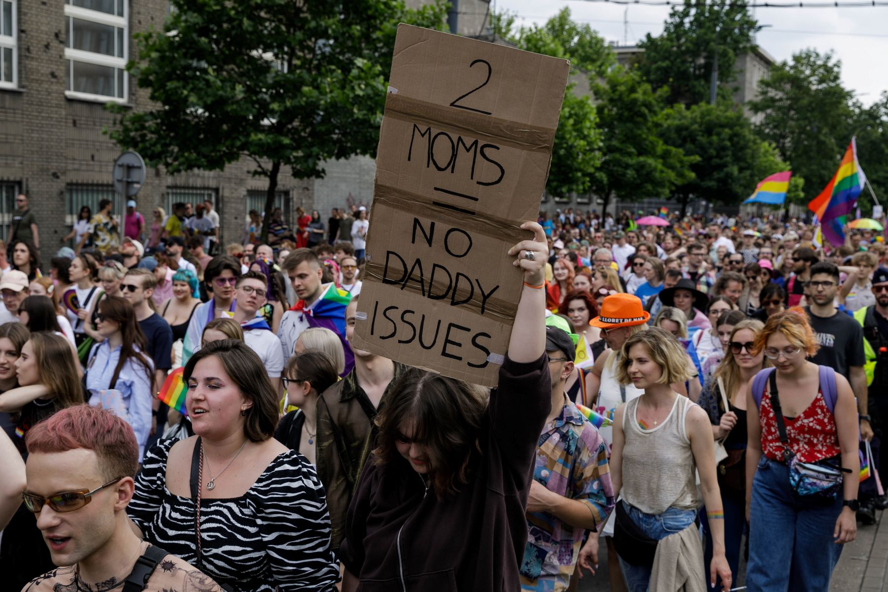 a sign writing two moms no daddy issues