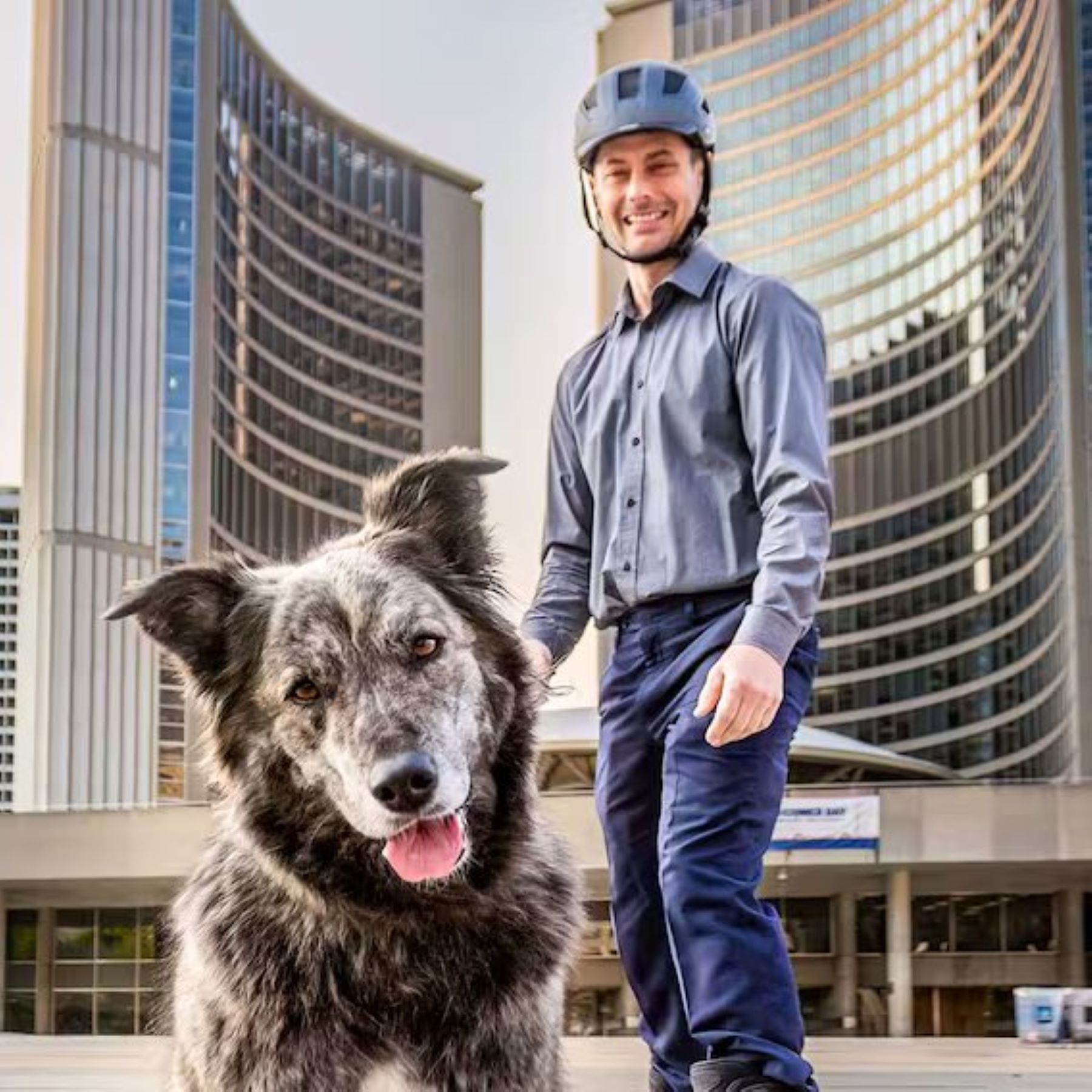 Molly and the human candidate Toby Heaps pose for a picture. Toby appears to be on skates