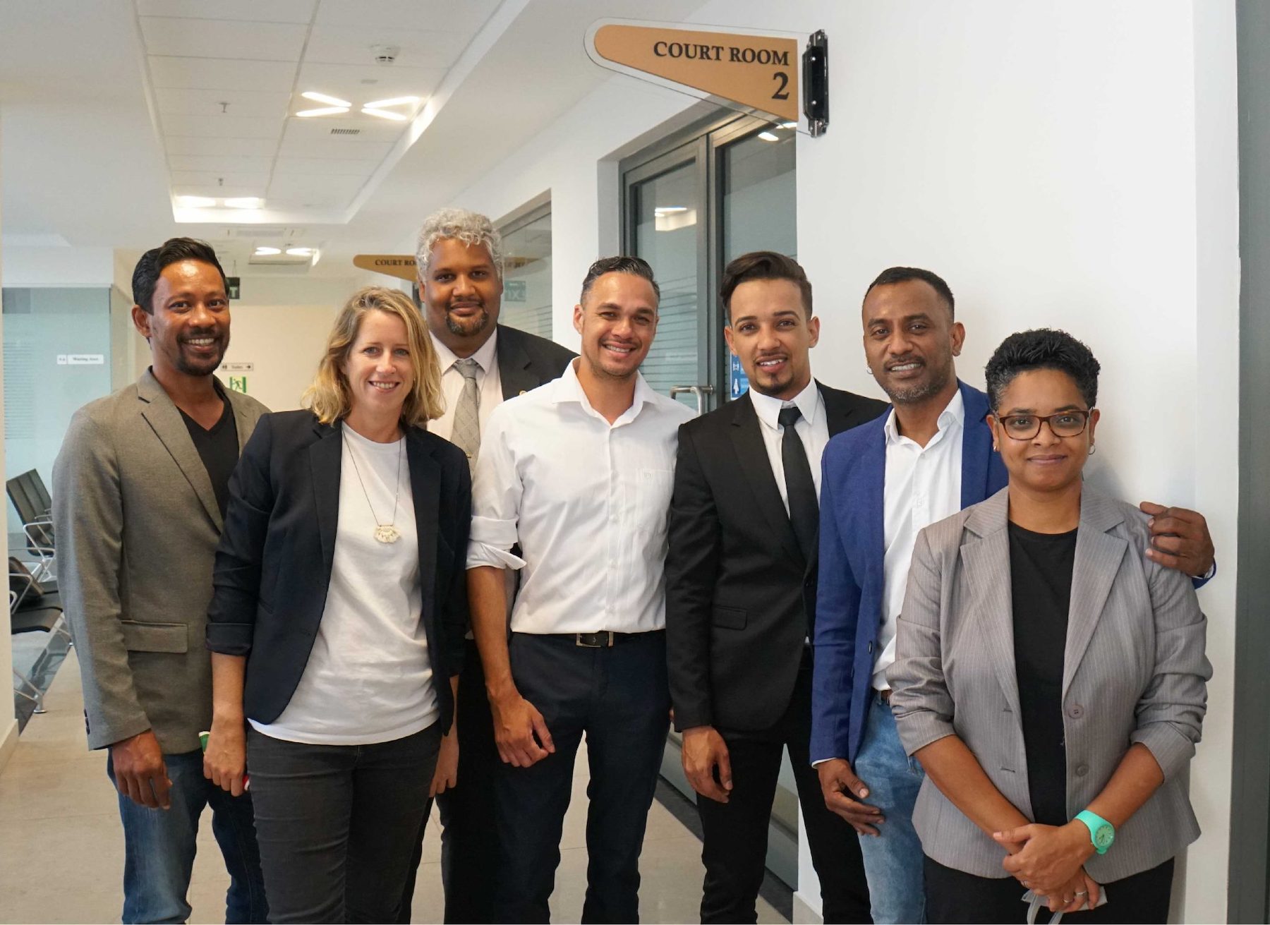 Gay activist, Ryan Ah Seek, with members of CAEC at the Supreme Court in November 2021.