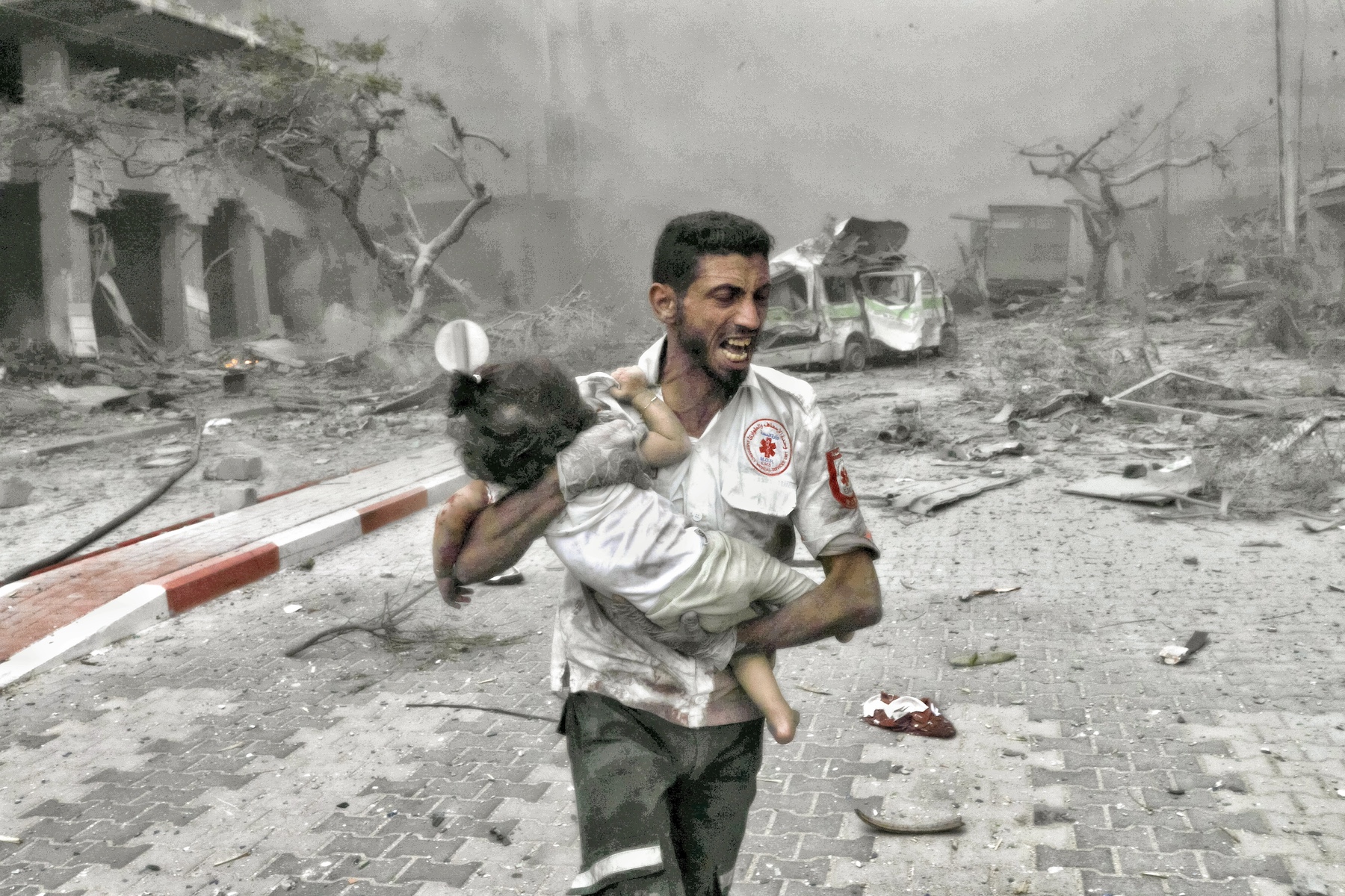 medical worker rushes a child israel palestine