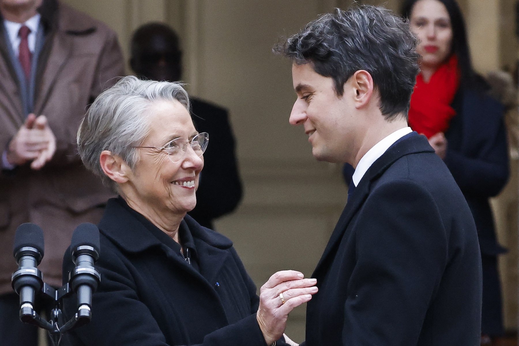 Prime minister Gabriel Attal greets Prime minister Elisabeth Borne