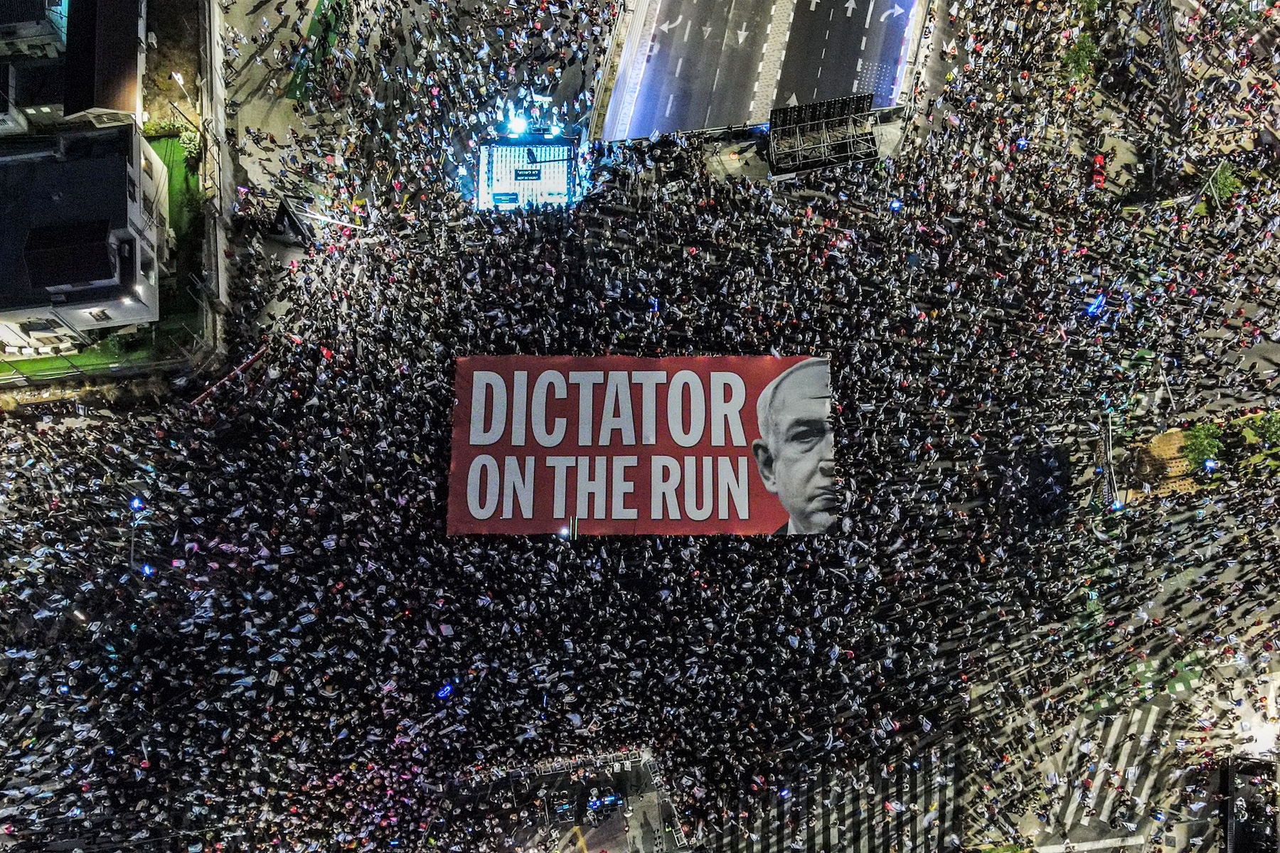 unfurling a giant banner against Israeli Prime Minister Benjamin Netanyahu