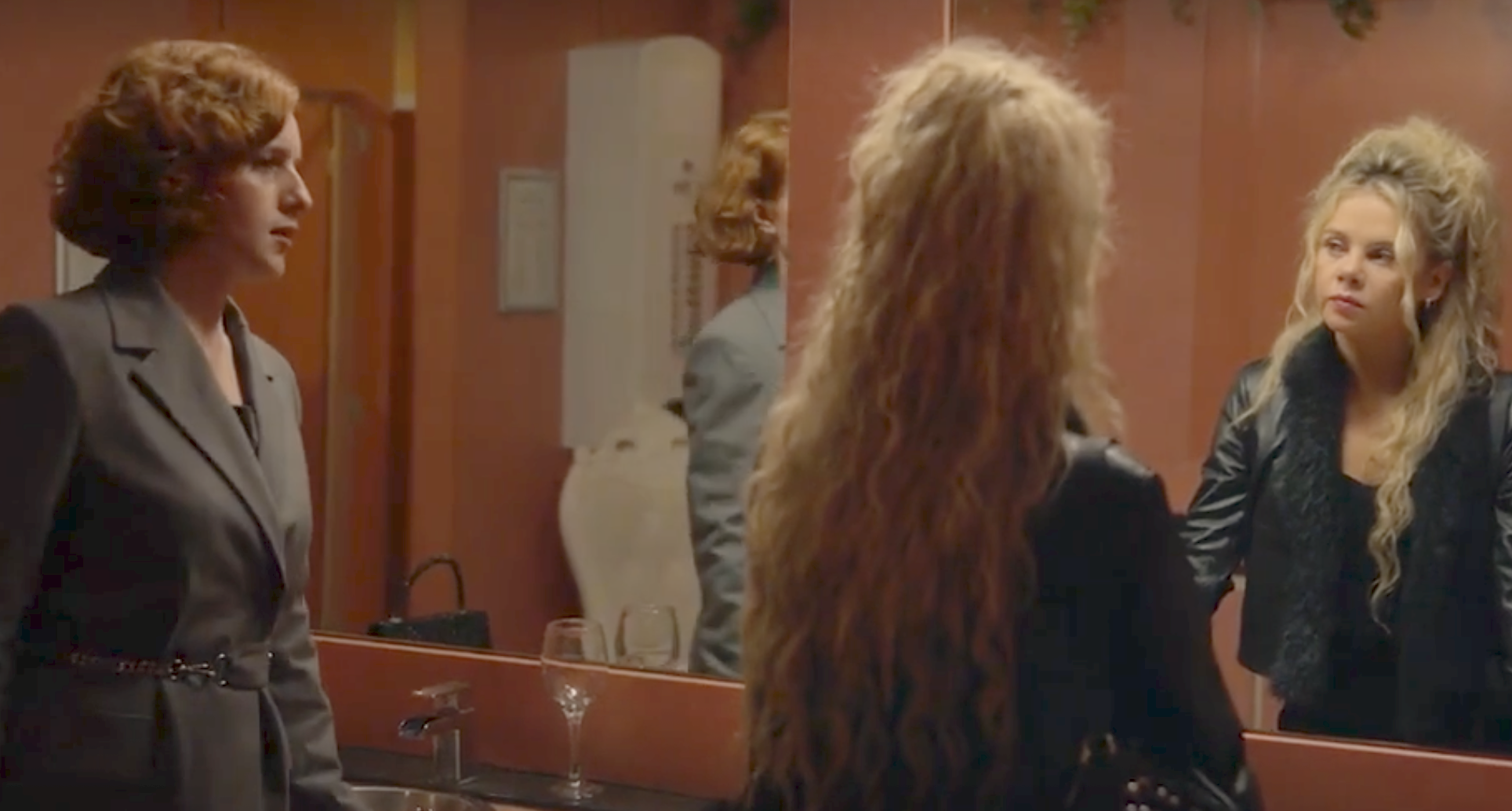Diana (Hannah Onslow) and Cheryl (Saoirse-Monica Jackson) talk in front of a mirror.