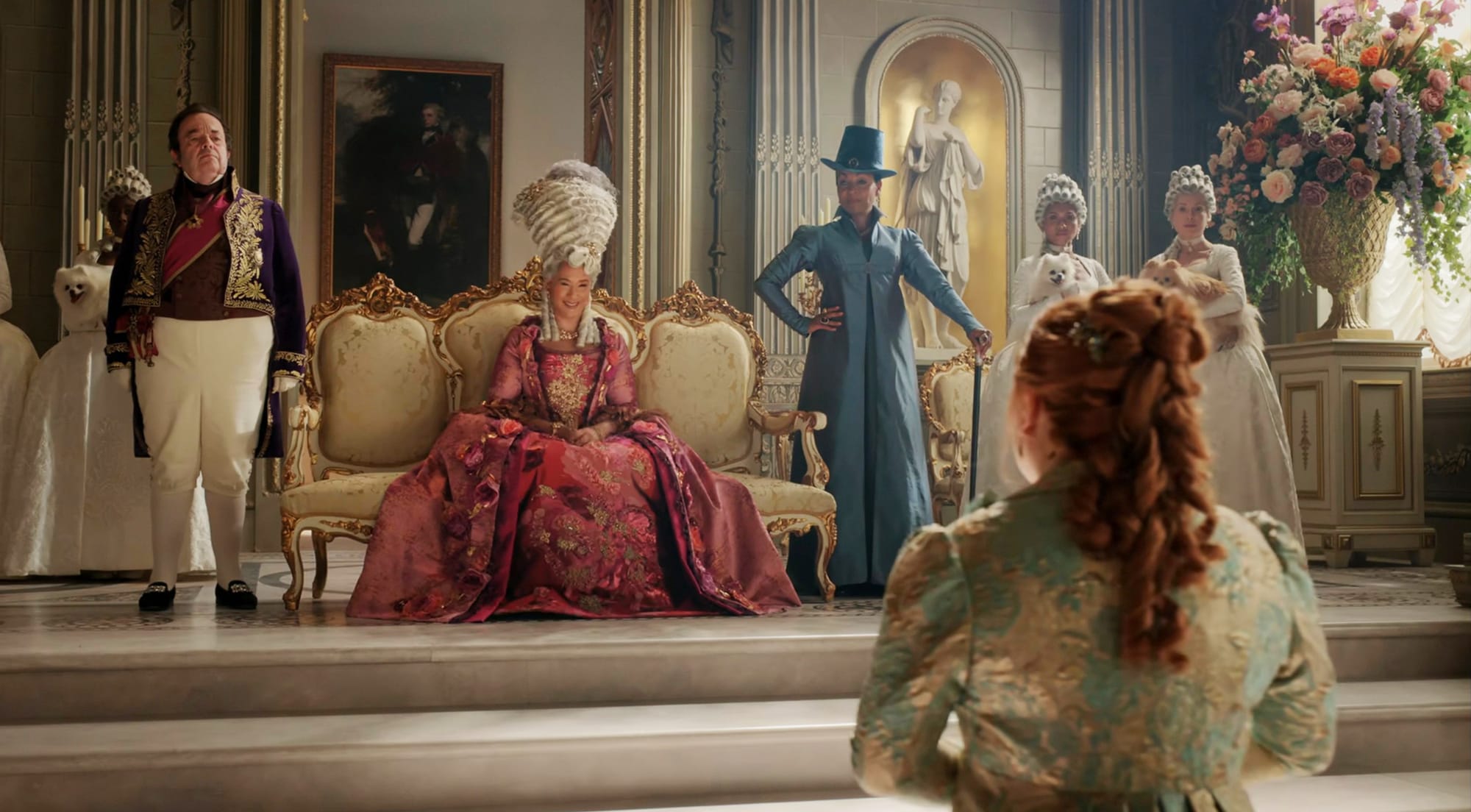 Hugh Sachs as Brimsley, Golda Rosheuvel as Queen Charlotte, Adjoa Andoh as Lady Danbury, and Nicola Coughlan as Penelope Bridgerton in 'Bridgerton' Season 4.